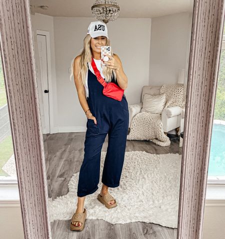 July 4th outfit. Sized up to a large in the tank top and jumpsuit. Free people inspired jumpsuit. 4th of July. Memorial weekend. Red, white and blue. Belt bag. Summer fashion. Trucker hat. Lake outfit 

#LTKFind #LTKunder50 #LTKsalealert