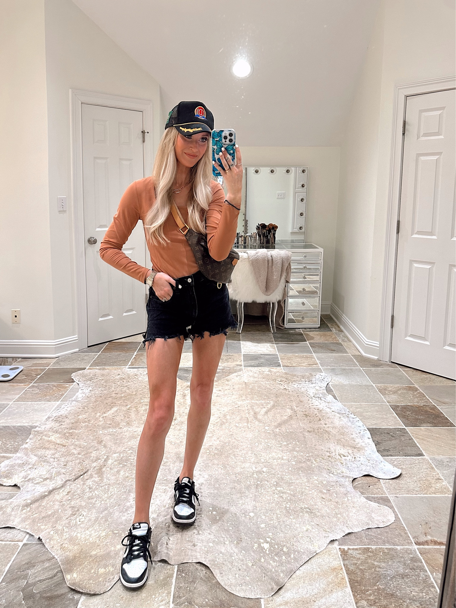 OOTD -  nuuds body suit (size S, clay), Agolde shorts (size 26), Nike pandas, and trucker hat (on pre order). Linked my purse & a few similar options:)

#LTKshoecrush #LTKstyletip #LTKunder50