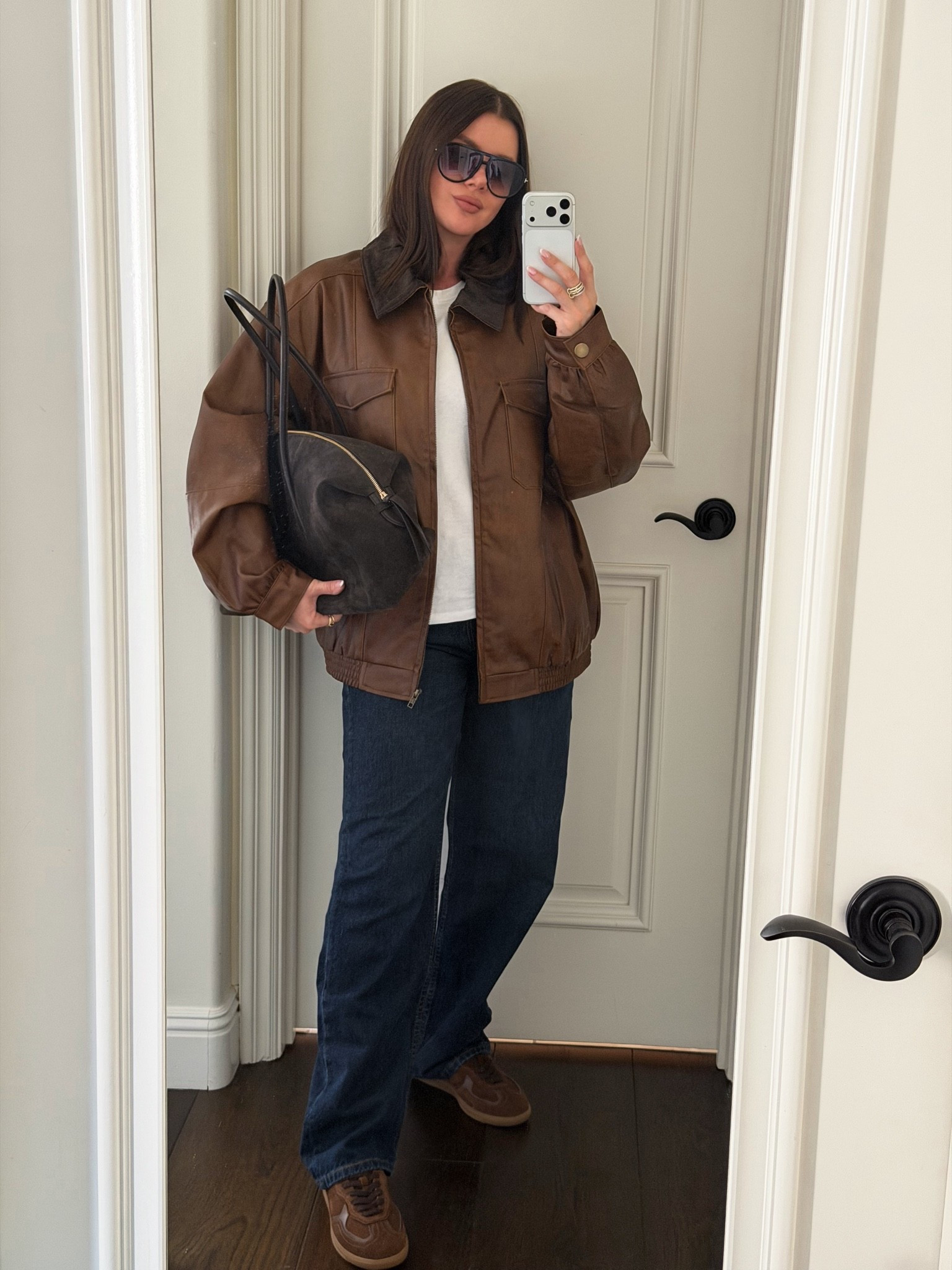 Casual fall outfit. Styling a leather jacket with dark denim, white shirt, chocolate brown suede sneakers, chocolate brown suede bag, aviator sunnies, and some jewelry to elevate the look 
#falloutfit #casualoutfit #falljacket

#LTKgrwm #LTKootd #LTKSeasonal