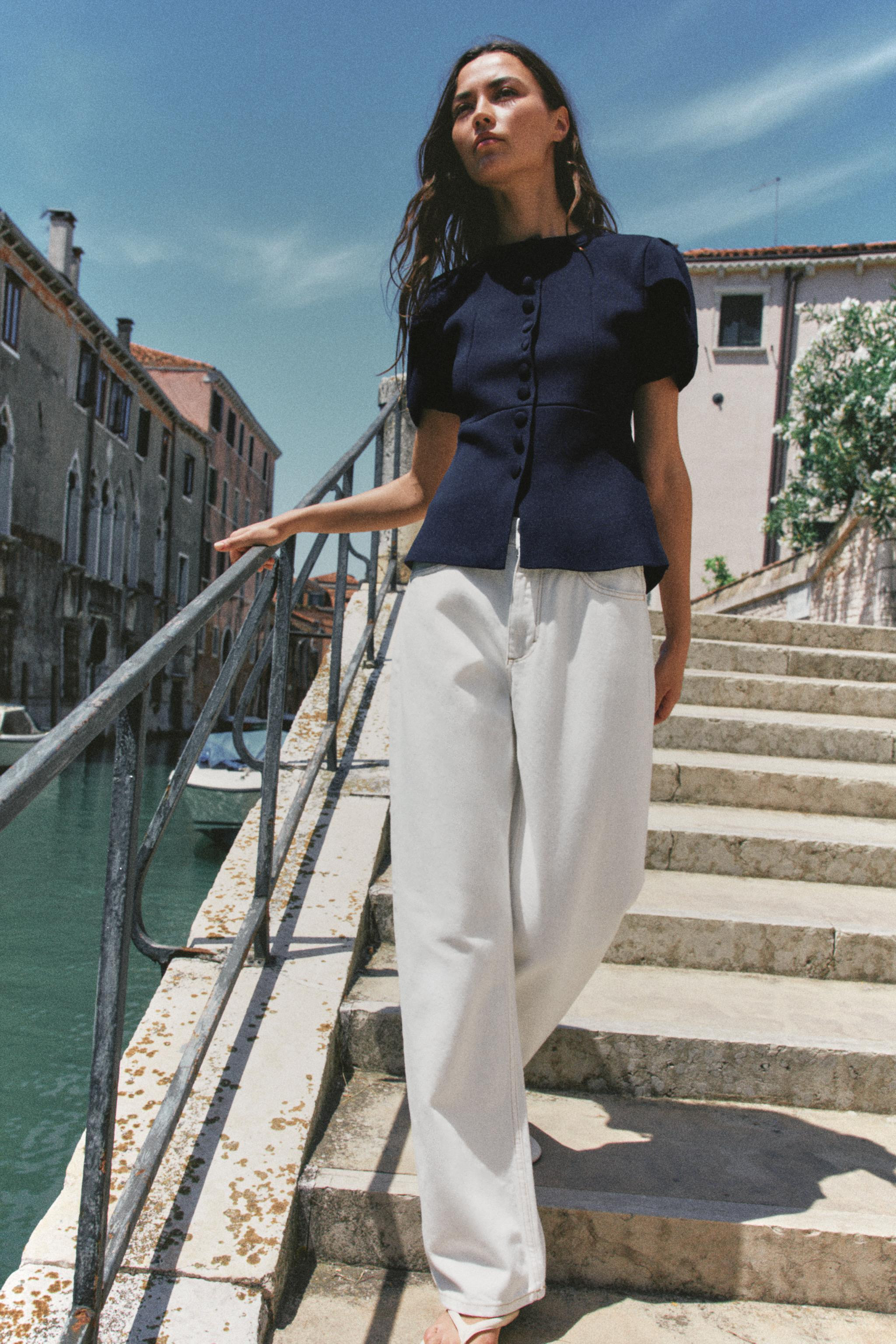 Tailored cardigan with a round neckline and short puff sleeves with slit detail. Front closure wi... | Zara US