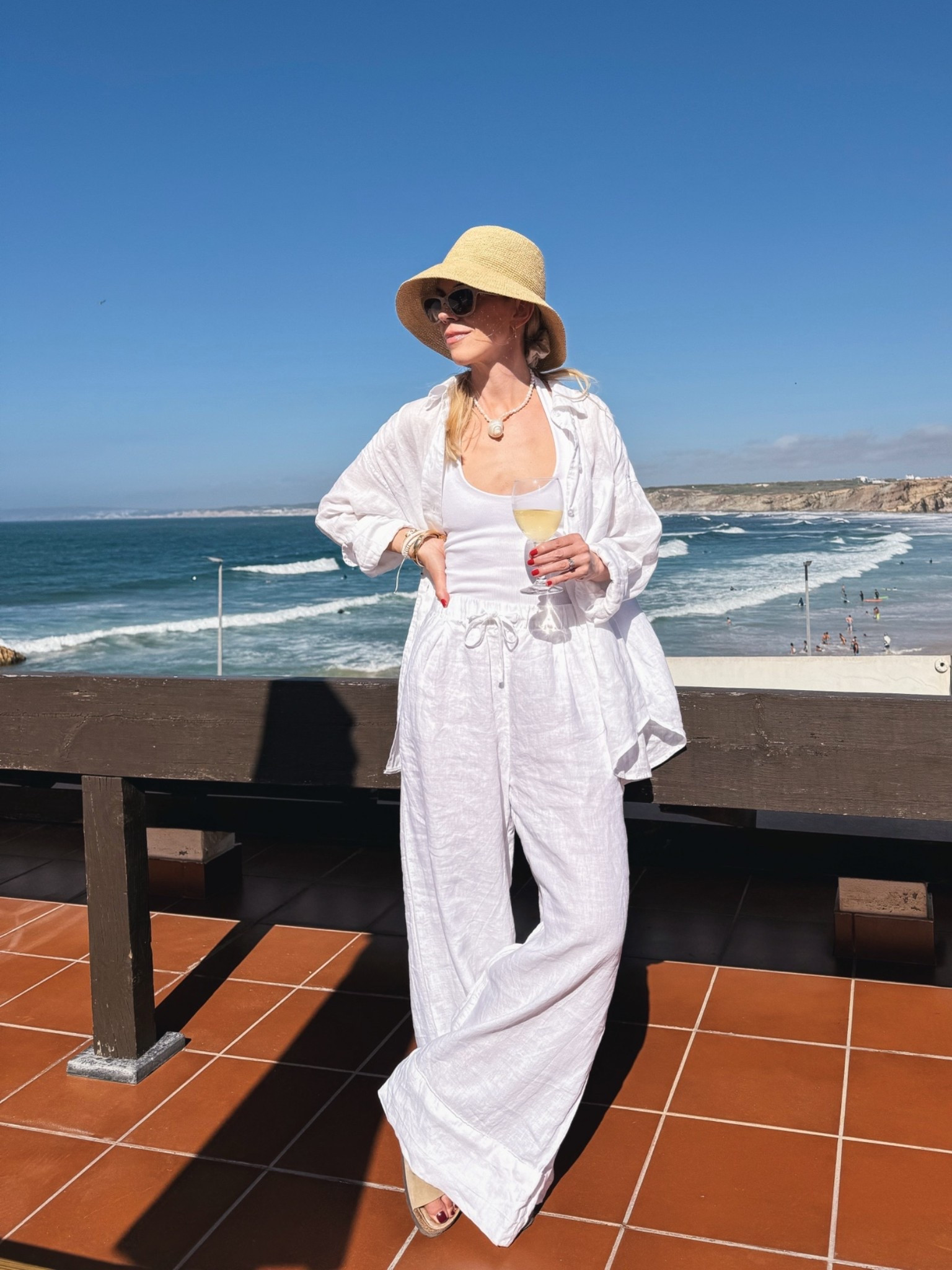 Beach vacation outfit, @Janessa Leone straw bucket hat, white linen shirt, all white linen outfit, linen pants

#LTKOver40 #LTKSeasonal #LTKTravel