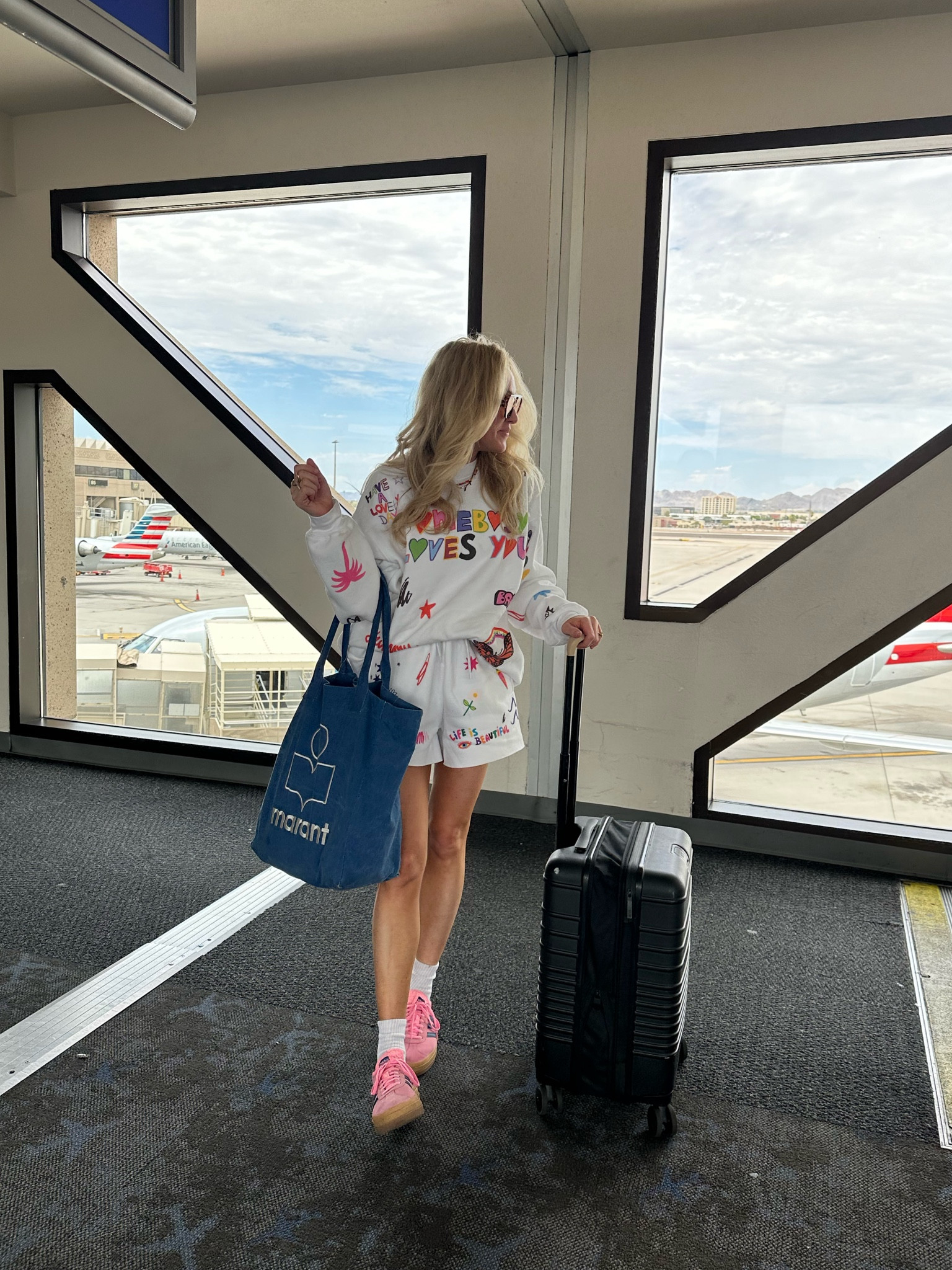 Matching short jogger set (runs tts) and adidas platform gazelle sneakers (order one full size down). Also linking my favorite carry on luggage! 

#LTKTravel #LTKShoeCrush #LTKStyleTip