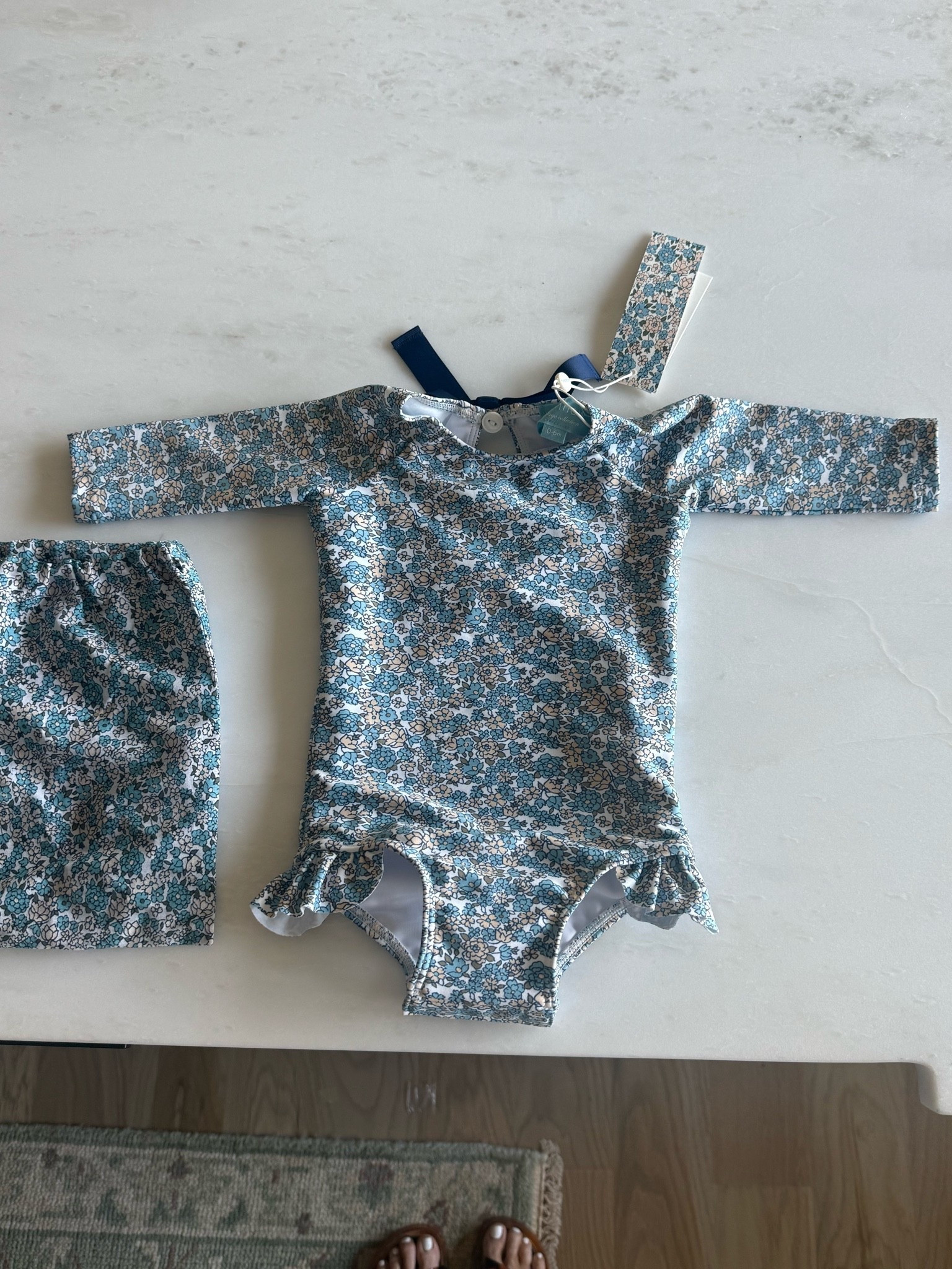 So cute for the littles. It has a ruffle detail at the leg, bow detail in the back, and UPF 50+ fabric. 💙