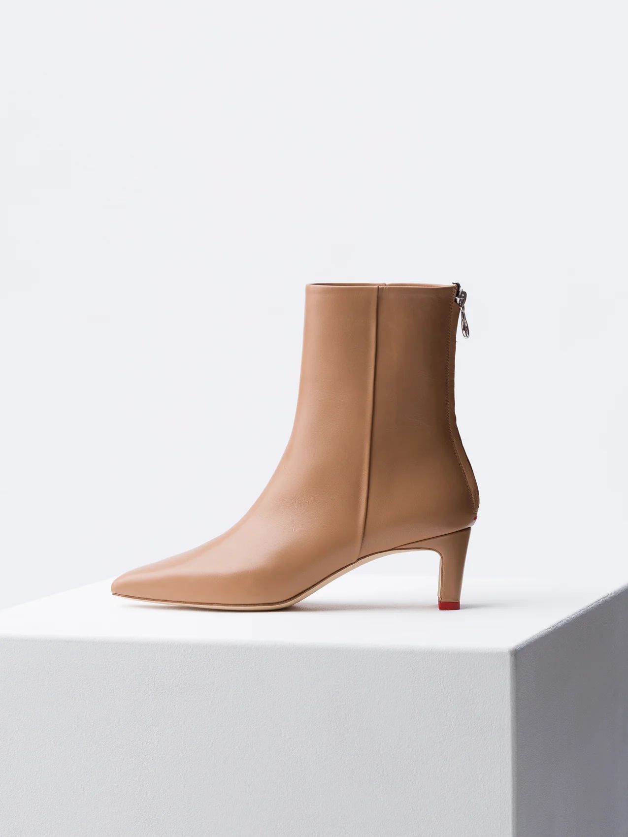 IVY embodies aeyde's approach to everyday wearable luxury. This is a super-slick mid-height ankle... | aeyde.com
