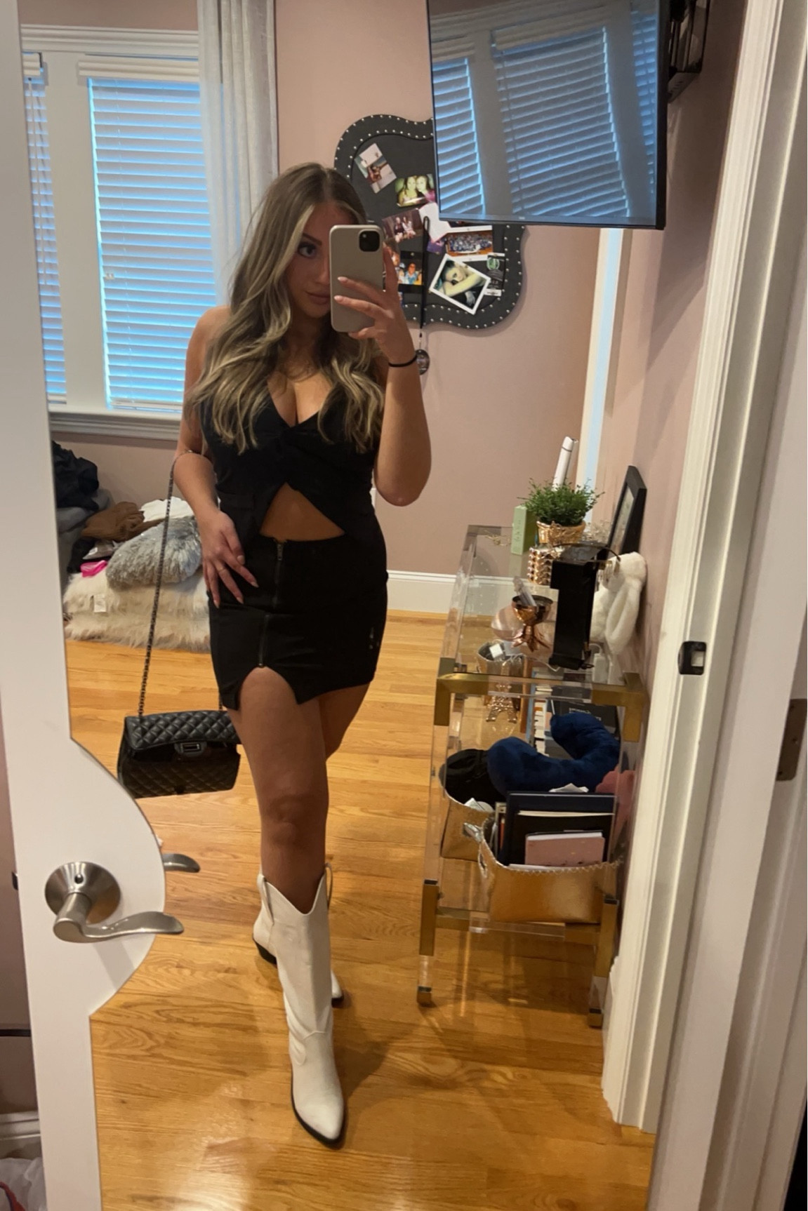 Country western outfit. Perfect for this summer and some country concerts 🤠

Black button up vest
White cowboy boots
Black mini skirt 

#LTKfindsunder50 #LTKFestival #LTKSeasonal