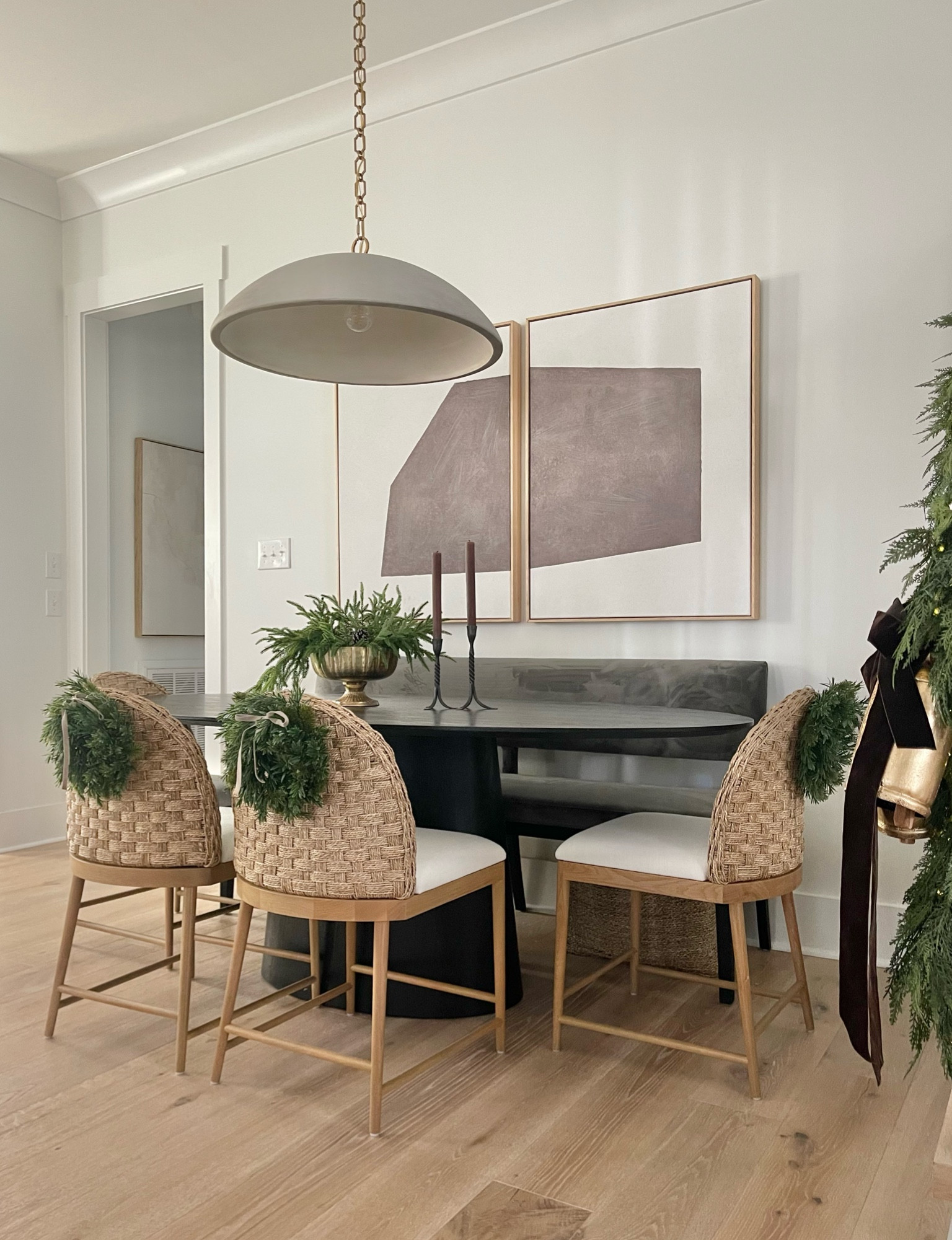 Merry Christmas!  My dining room furniture is on end of year clearance!  

#diningroom #blackdinigtable #rattandiningchairs #diningroom #concretependant #ovaltable 

#LTKHome #LTKSaleAlert