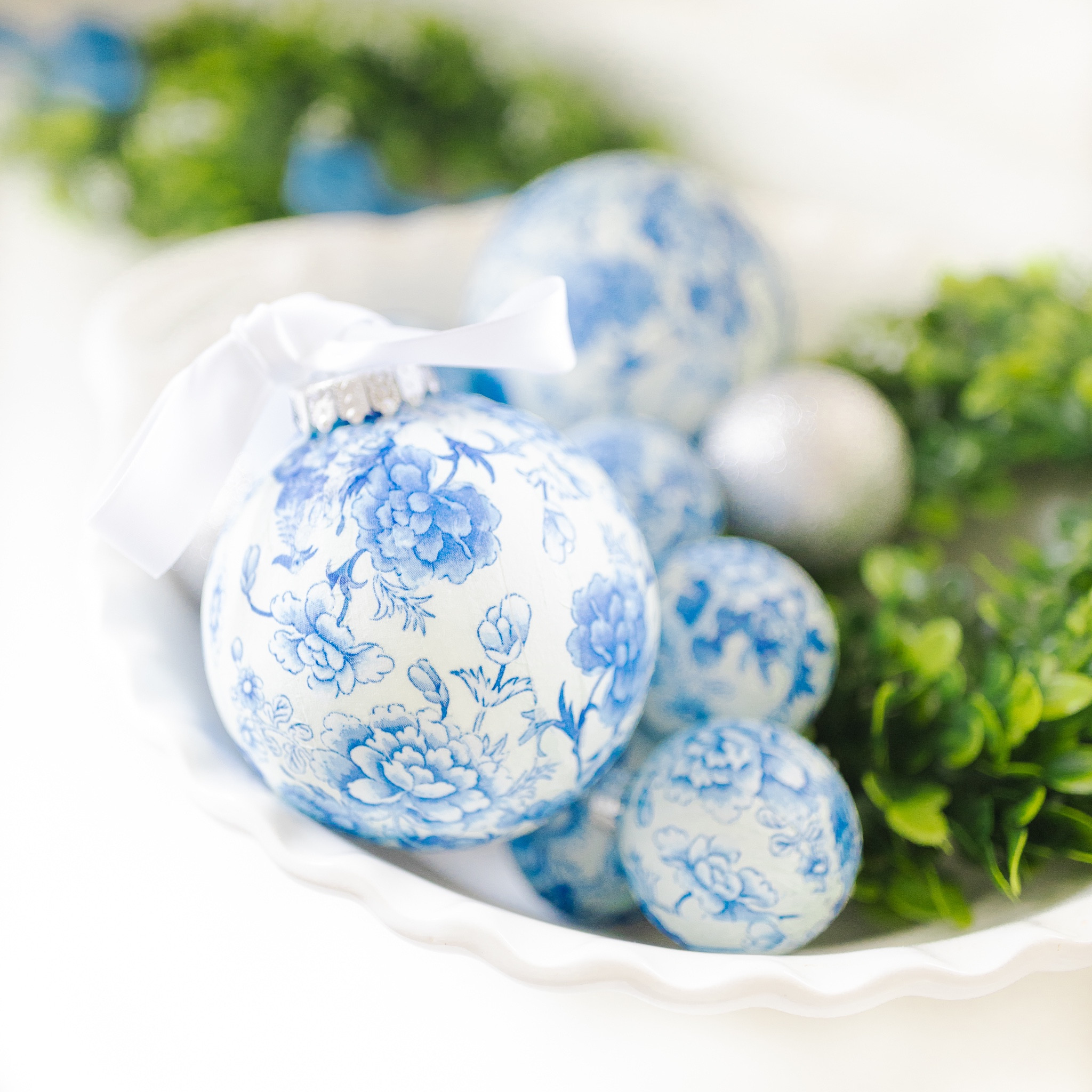 Made a handful of chinoiserie ornaments with some Mod Podge and pretty blue and white paper napkins! Linking all DIY Christmas decor supplies 💙🤍 

#LTKhome #LTKSeasonal #LTKHoliday
