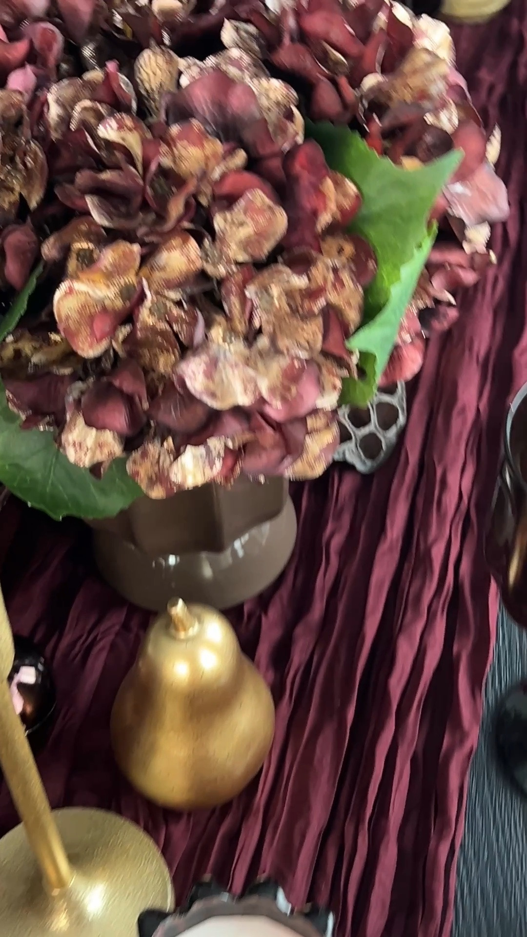 Moody fall centerpiece, burgundy and brown tablescape, chocolate brown fall decor, burgundy table decor, fall floral arrangement, fall centerpiece ideas, Thanksgiving centerpiece, Thanksgiving tablescape, fall hosting decor, moody tablescape, dried fall florals, brown floral stems, decorative pears, burgundy candles, taper candles, brass candlesticks, amber glass vases, fall table decorations, layered centerpiece, modern fall table, elegant fall decor, autumn dinner party, holiday hosting inspiration, warm neutral fall decor

#LTKHome #LTKSeasonal
