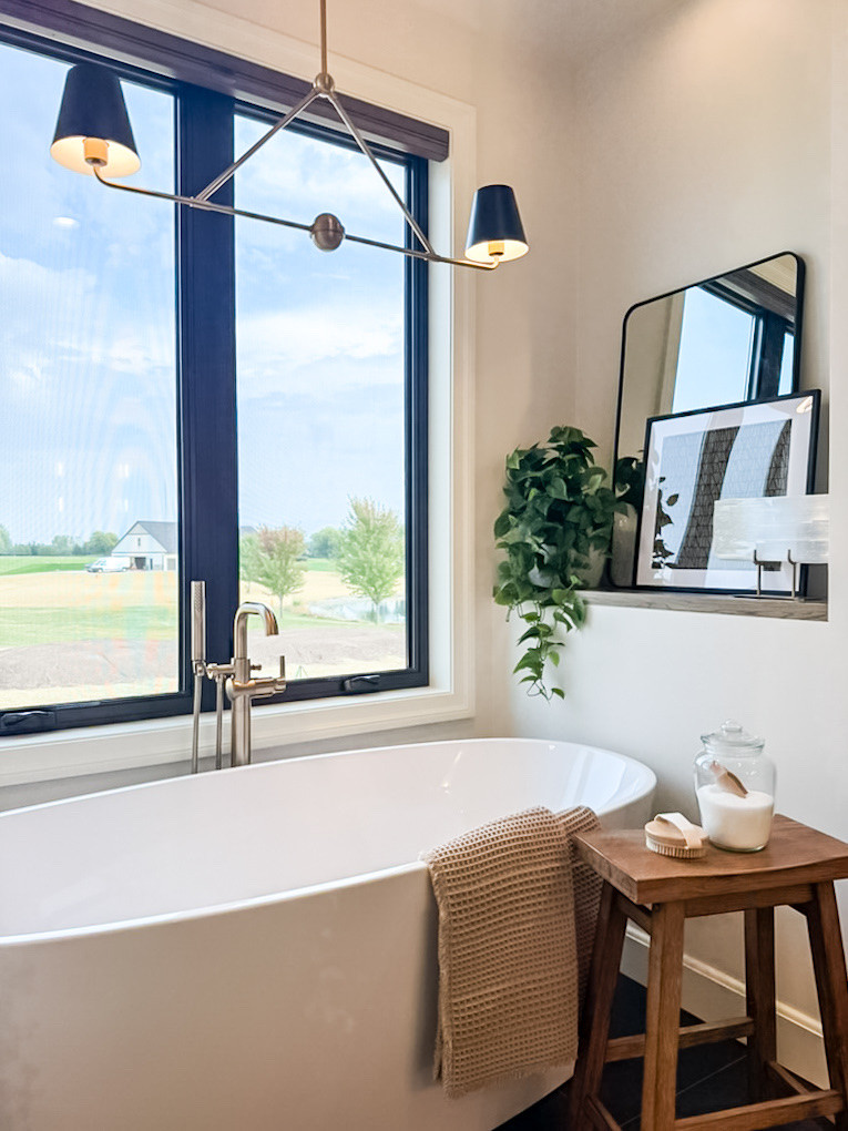 A stylish bathroom with a soaking tub invites relaxation with its soft ambient lighting, and spa-like atmosphere. 

#homedecor #homedesign #interiordesign #bathroom 

 #LTKHome