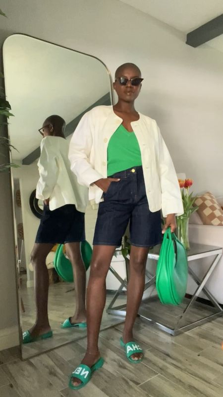 Spring outfit! Green sleeves top, dark denim mid length shorts, cream collarless utility jacket, green slide sandals, green purse  

#LTKshoecrush #LTKVideo #LTKfindsunder100