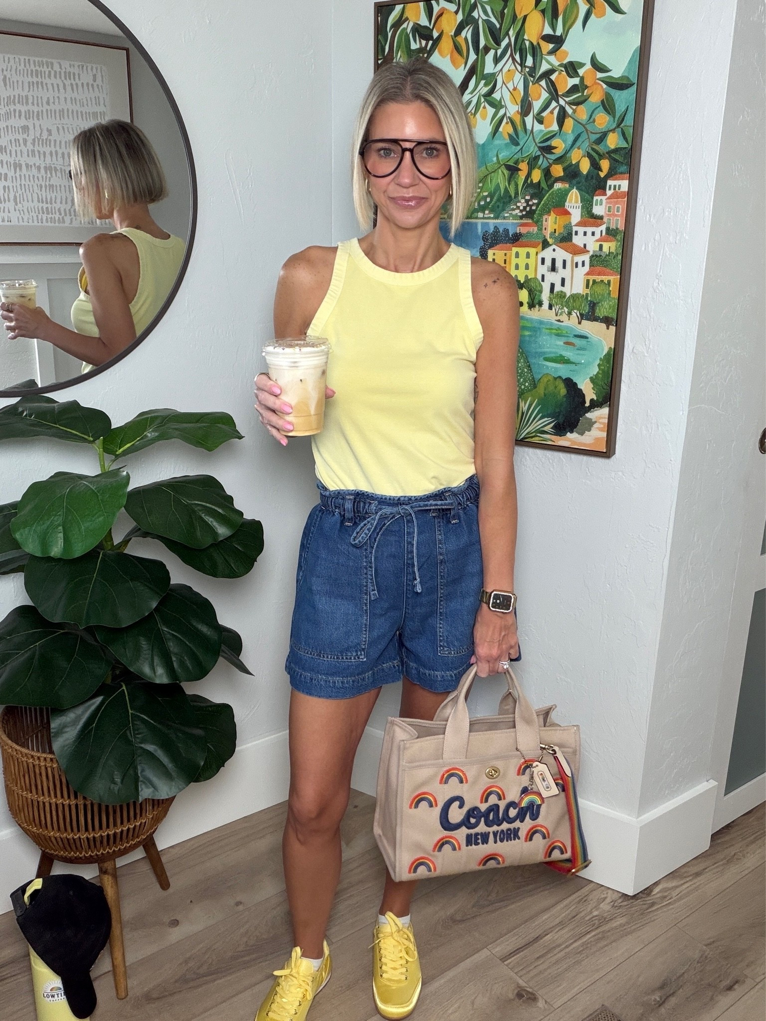 Shorts and a tank are the summer uniform in Florida! Both items are from Walmart, making this outfit super affordable! The elastic waist and tie string shorts are beyond comfortable. I’m wearing an XS and they run a little large. 

My yellow sneakers are from Amazon!