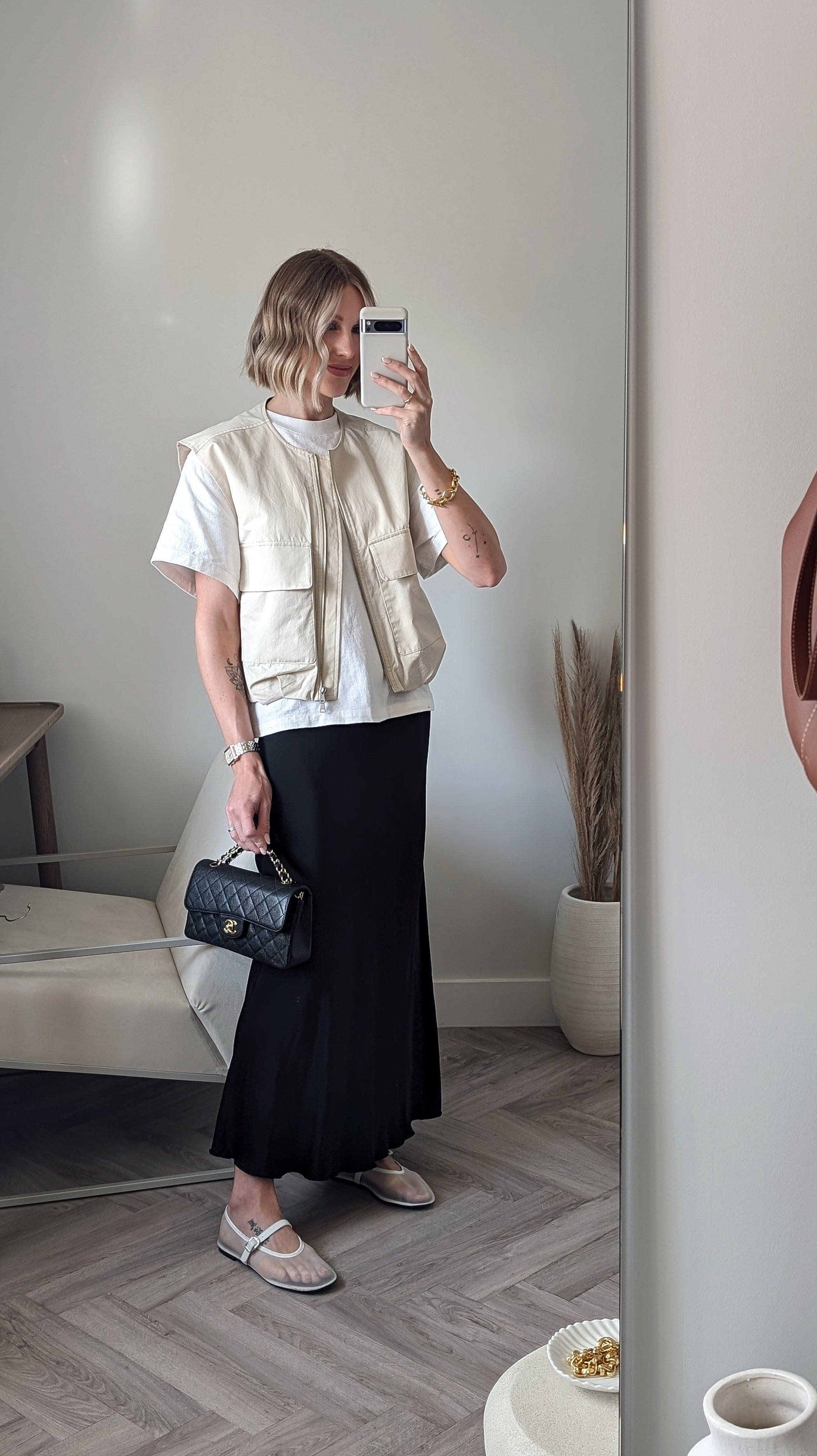 smart casual dinner date outfit 🍽️ Satin maxi skirt - Arket 36Jil Sander t-shirt size SUtility vest - Stradivarius size SMango white mesh ballet flatsvintage Chanel small flap caviar - xupes linked similar 

#LTKshoecrush #LTKitbag #LTKSeasonal