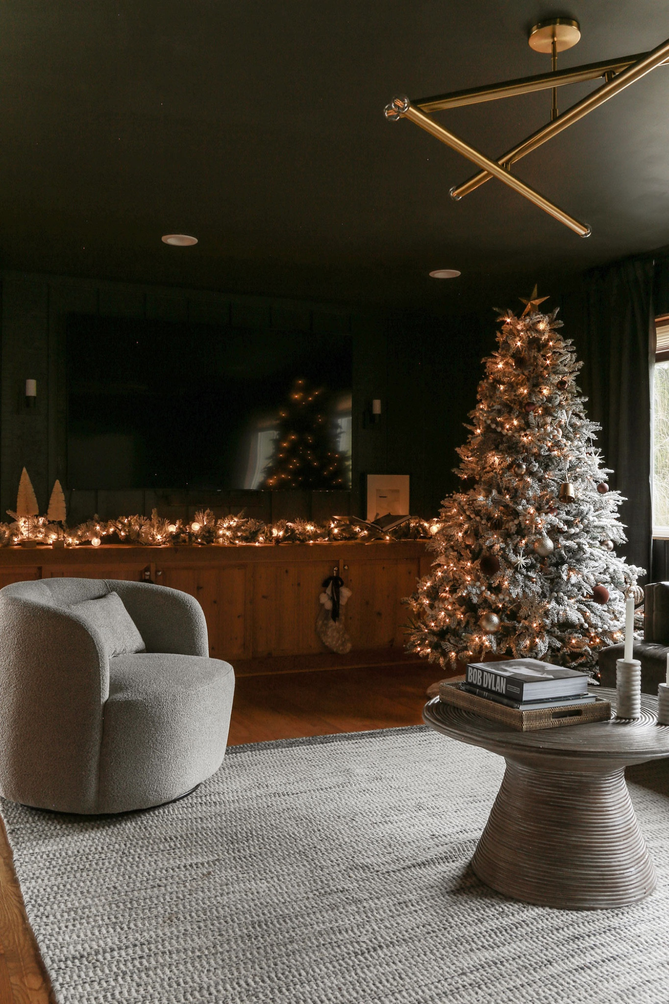 #AD Wrapping up my holiday home makeover with some serious help from @loweshomeimprovement. 🎄✨
Right now, their December Deal Drops are absolutely 🔥, so keep your eyes peeled. Every week, they're dropping fresh discounts on all kinds of goodies.
I’m all about that winter wonderland vibe at my lake cottage, so I snatched up some epic Holiday Decor & Ornament Storage pieces to level up the holiday magic. Don’t sleep on these deals! #LowesPartner
#christmasdecor #holidaydecor #affordabledecor #flockedgarland #swivelchair #livingroomdecor 

#LTKFindsUnder50 #LTKHoliday #LTKHome