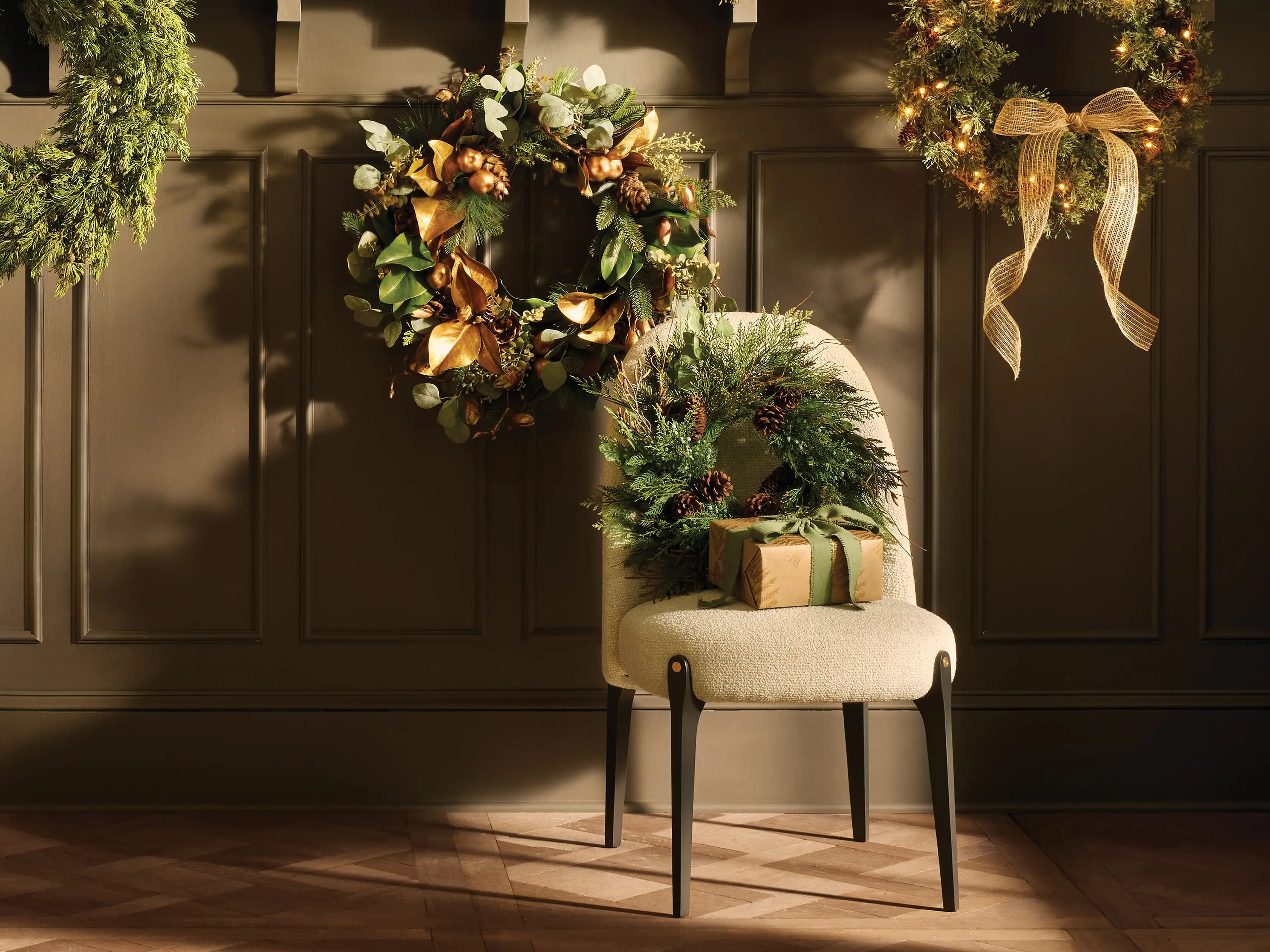 Crafted to capture the natural beauty of greenery and pinecones, this faux wreath will look fresh... | Arhaus