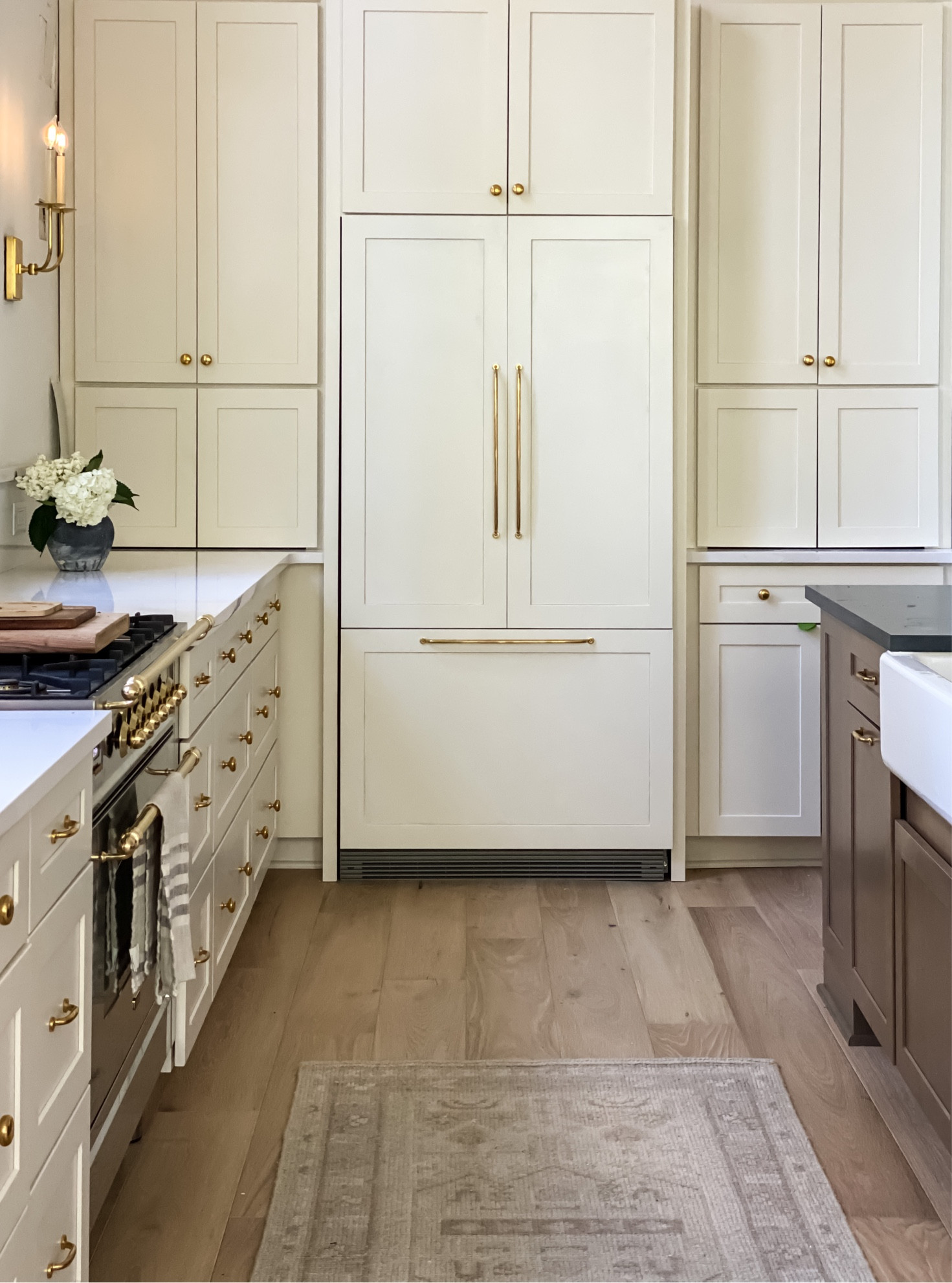 Kitchen sources | unlacquered brass, farmhouse sink, vintage rug | builtin refrigerator | sconces

#LTKhome