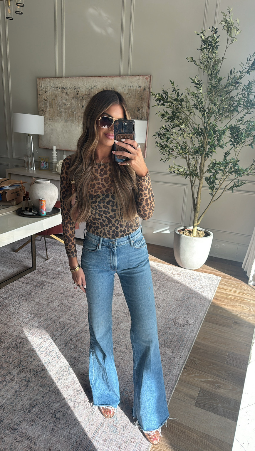 wearing a small top and 27 denim 🐆 use code happy20 on revolve! 

 