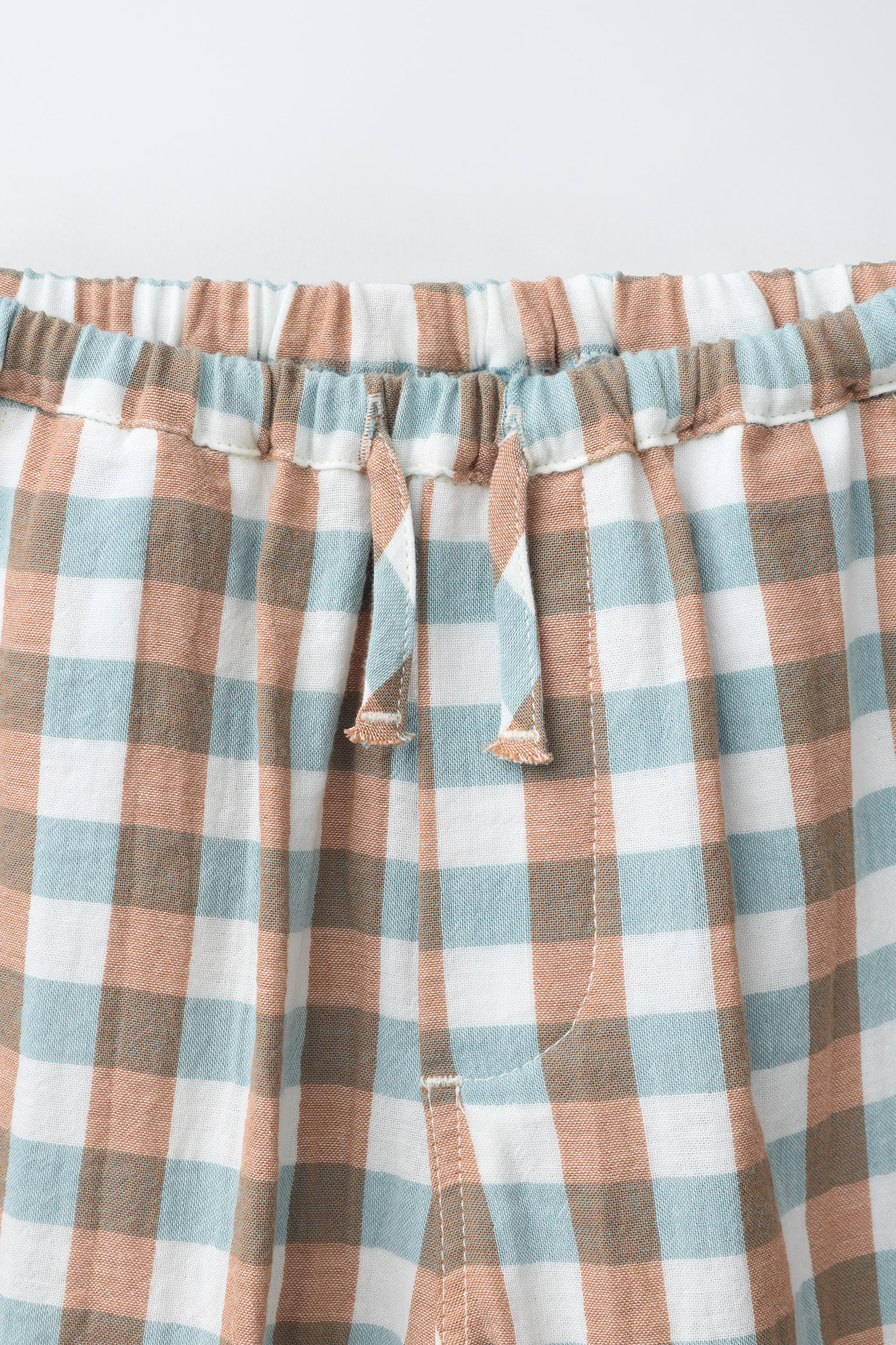 Balloon trousers featuring an elastic waistband with an adjustable drawstring. Front pockets. Gin... | Zara UK