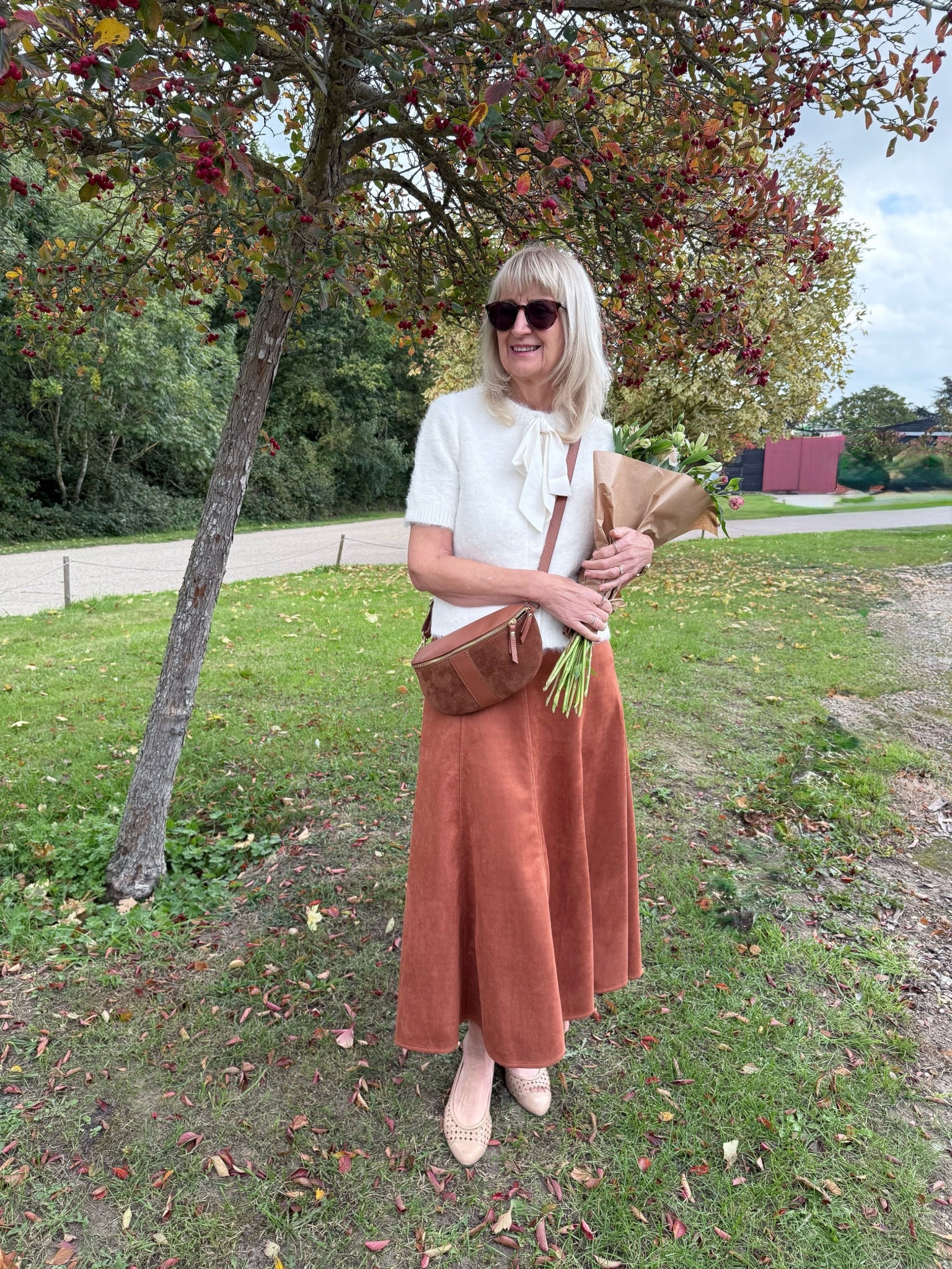 Autumn /Fall Outfit 
Faux suede mid skirt with white fluffy cardigan with short sleeves and a bow. 

#LTKautumn #LTKeurope #LTKuk
