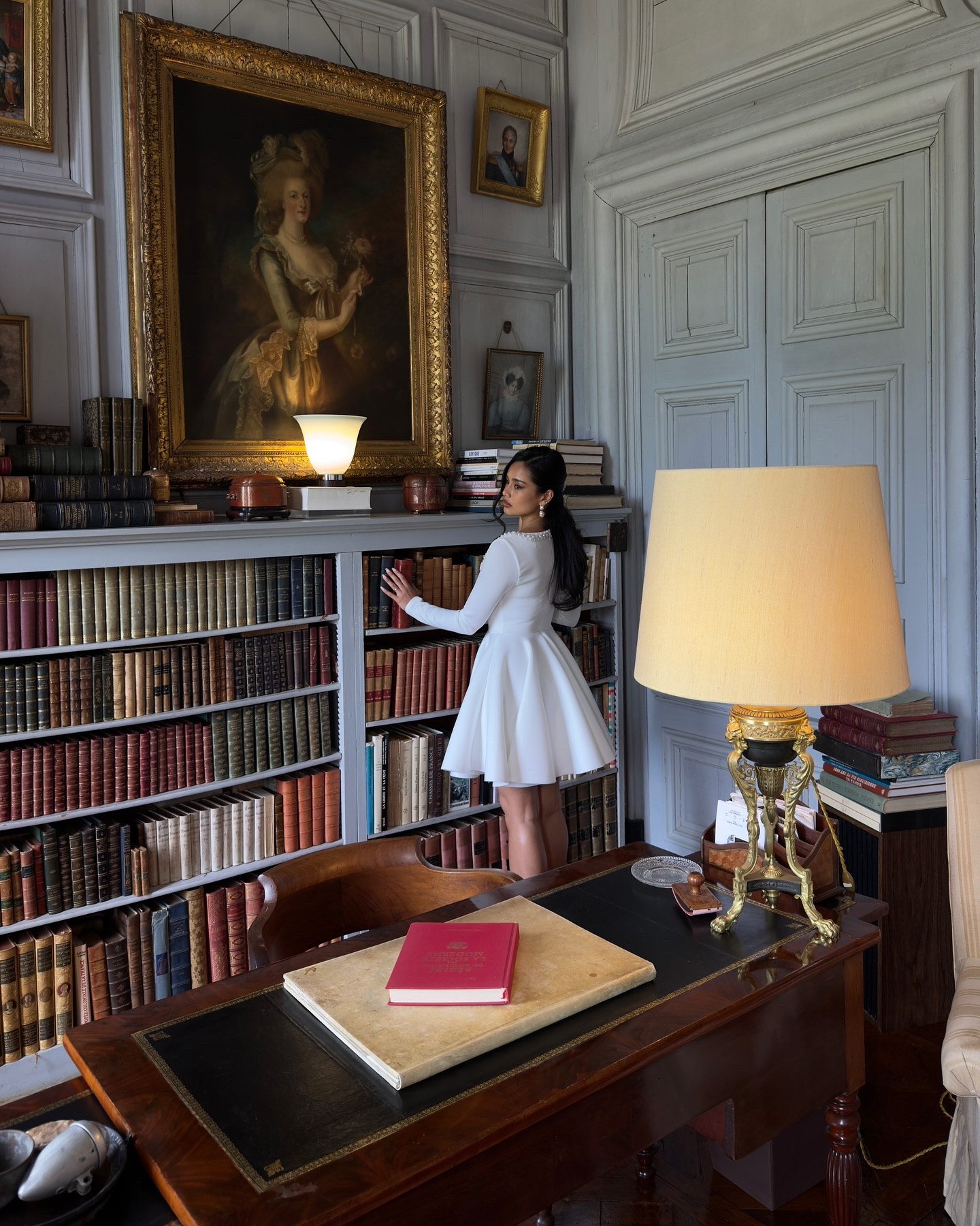 A quiet moment at Château de Boucéel, where every corner tells a story. 

🧳🤎🗝️🕰🎞

This 18th-century family château in Normandy is more than a historic monument—it’s a living memory of refinement and resilience, once owned by Count Régis de Roquefeuil and his family for generations.

The library, one of my favorite rooms, is filled with antique leather-bound books, gilded frames, and heirlooms that whisper old-world charm.

The Louis XVI paneling, grand portraits, and vintage lighting create a cinematic ambiance—perfect for cozying up with Règles du Savoir-Vivre dans la Société Moderne.

Dressed in timeless white and pearls, I felt right at home in this regal setting. 

🤍 Comment ‘Love’ for the link of this dress 🤍

#ChateauDeBoucéel #FrenchChateau #NormandyFrance #LibraryMoments #TimelessStyle #HeritageInteriors #PearlsAndPages