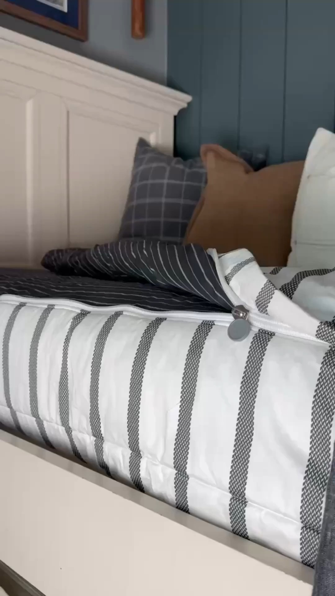 Layered, cozy, and effortlessly timeless 🤍 This bedroom bedding setup features a striped quilt, neutral comforter, pinstripe duvet, and a mix of throw pillows in plaid, solid neutral, and textured fabrics. The white upholstered bed frame, paneled headboard, and blue shiplap wall create a calm, classic backdrop that feels both traditional and modern farmhouse. Perfect inspiration for layered bedding, guest room styling, or an everyday neutral bedroom refresh.

#eanesinteriors #bedroomdecor #layeredbedding #stripedbedding #neutralbedding #throwpillows #plaidpillows #bedroominspo #classicinteriors #modernfarmhouse #cozyhome #ltkhome #homedecor #beddingstyle

#LTKHome #LTKOver40 #LTKSeasonal