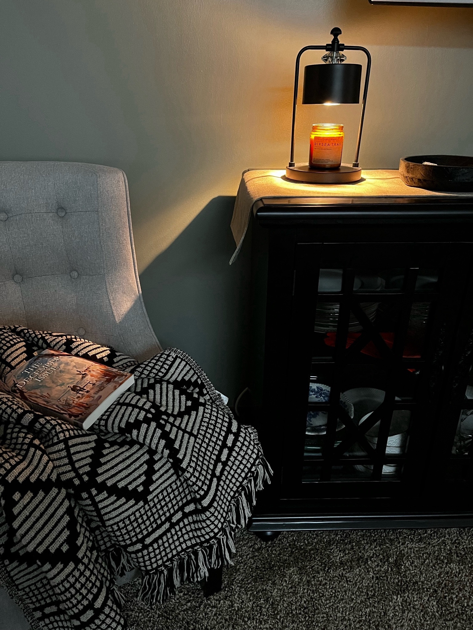 We needed more seating in the living room to accommodate guests over the holidays, so we added this transitional chair.

Now that they're gone, I like to curl up here with my coffee, woven blanket, and book in the mornings. 

If I'm feeling spicy, I’ll flip on my candle warmer lamp for mood. 

#LTKstyletip #LTKhome
