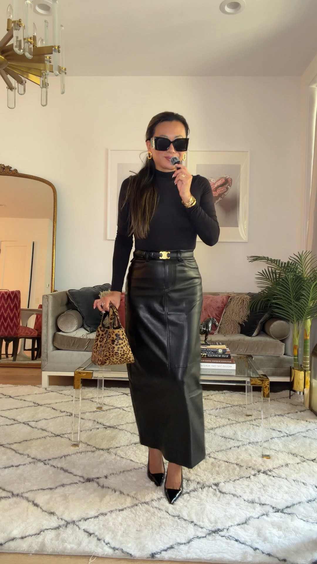Black faux leather skirt. Amazon bodysuit. Amazon shoes. Anaxim sunglasses. Fall and holiday fit that looks expensive for less