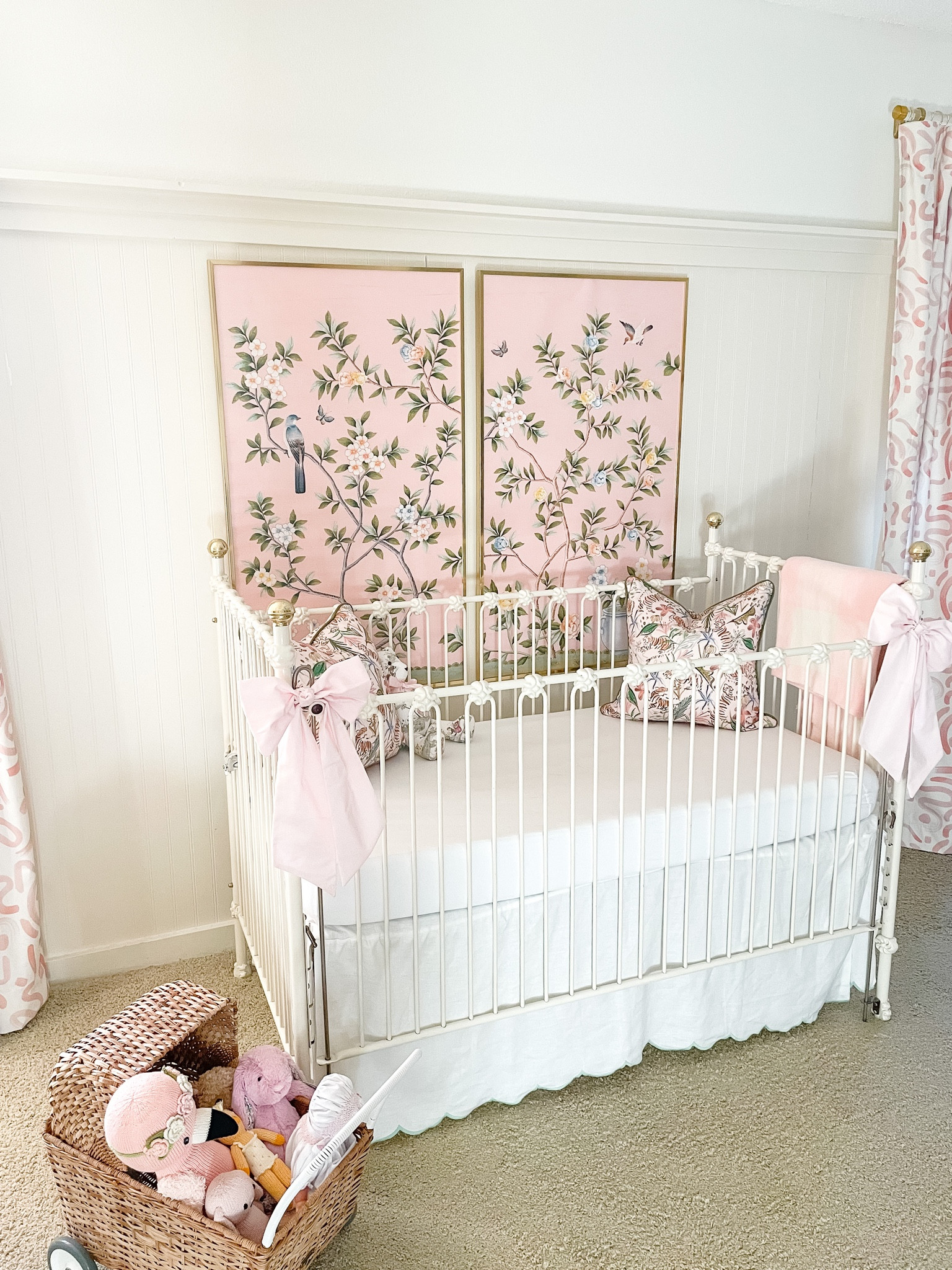 Pink girl nursery // grandmillennial //  palm beach // preppy nursery // pink and green // chinoiserie //crib bows // chinoiserie panels // rattan stroller toy // cuddle and kind // pepper home curtains 

#LTKbaby #LTKhome