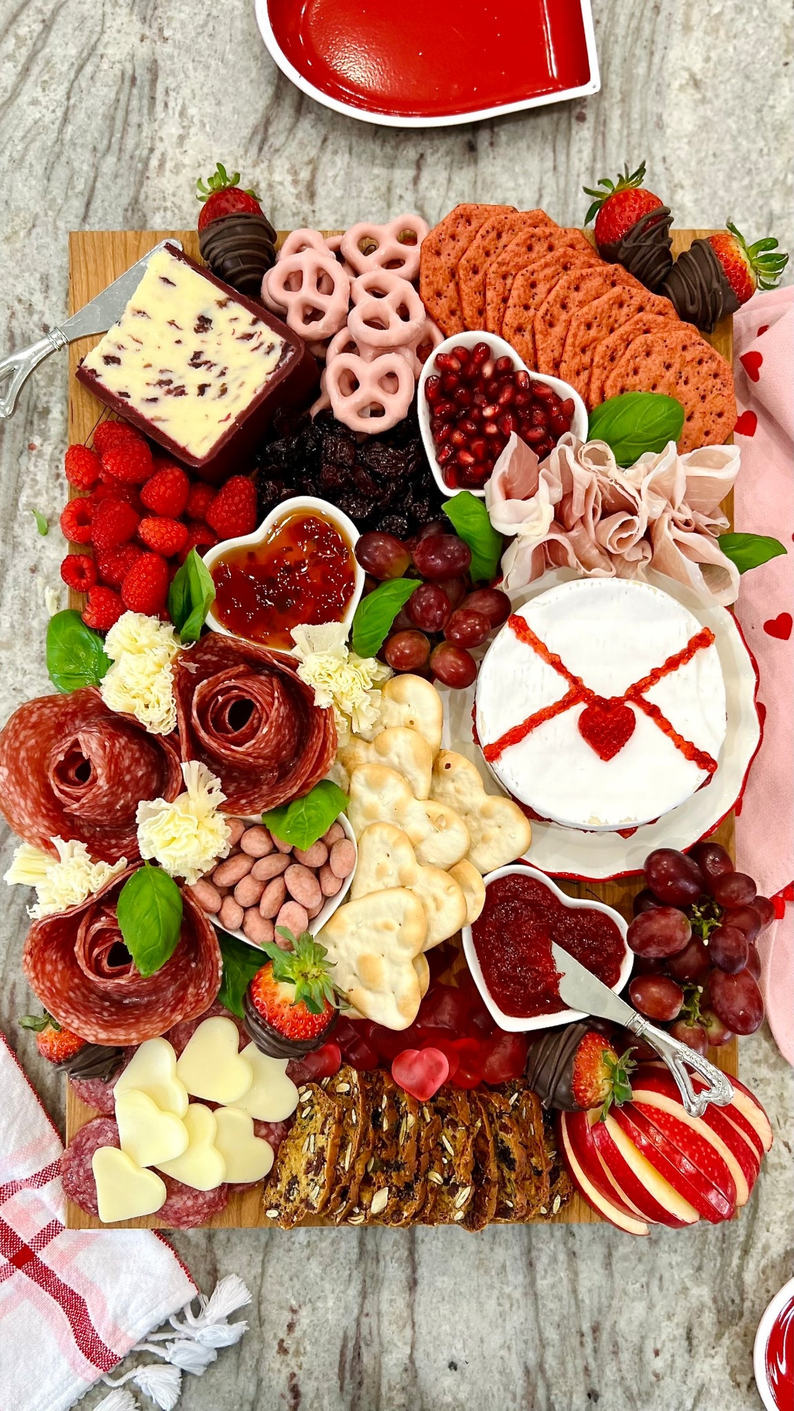 This love-filled charcuterie appetizer would be perfect to share with friends at your Galentine's Day party. Featuring a love letter made from brie and jam, and a bouquet of salami roses, it's as delicious as it is stunning! 

#LTKfoodie #LTKSeasonal