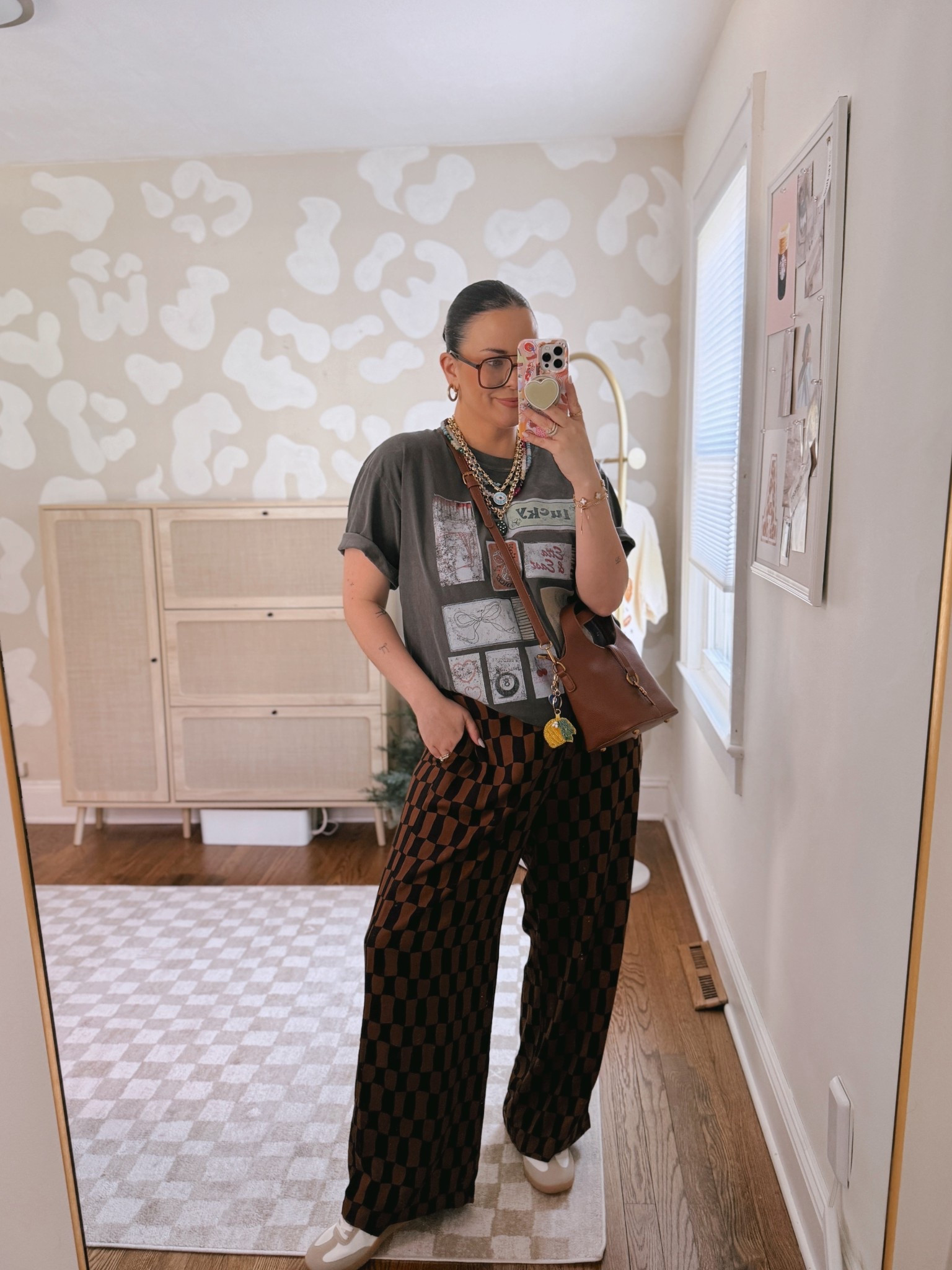Casual outfit! Love this cute graphic tee and checkered pants.. I’m in an XL in both, should’ve done a large in the pants’ 

#LTKStyleTip #LTKMidsize #LTKFindsUnder50