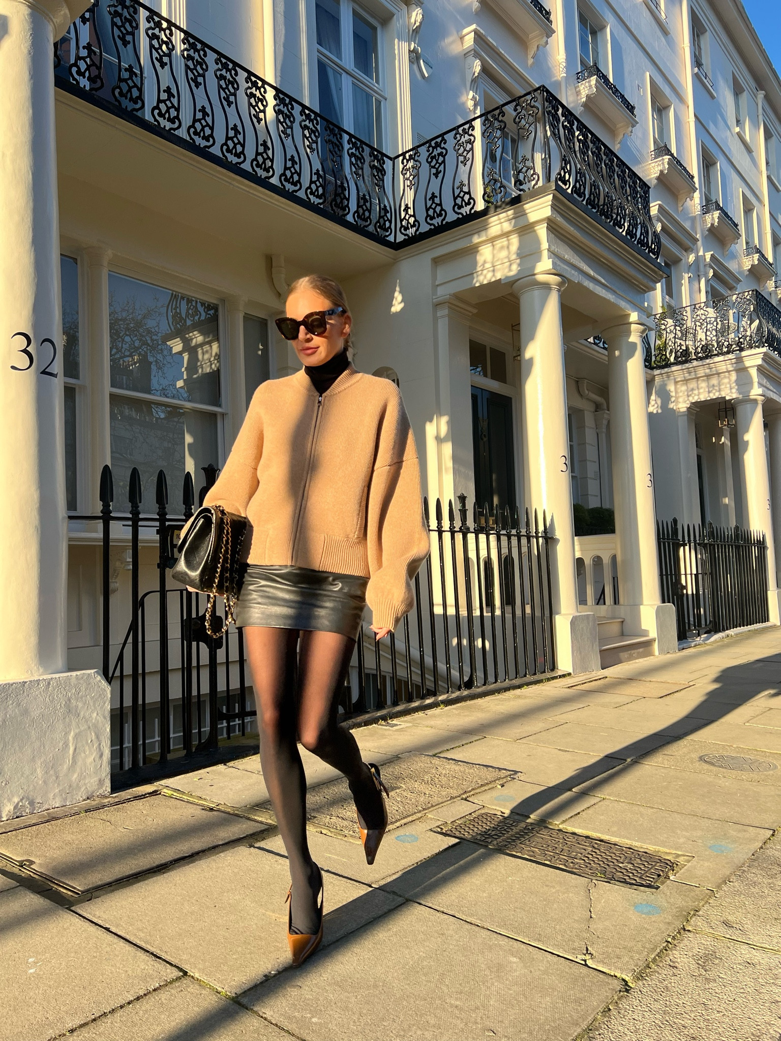 Khaite knitwear bomber jacket, Sezane leather skirt, ysl Saint Laurent heels 