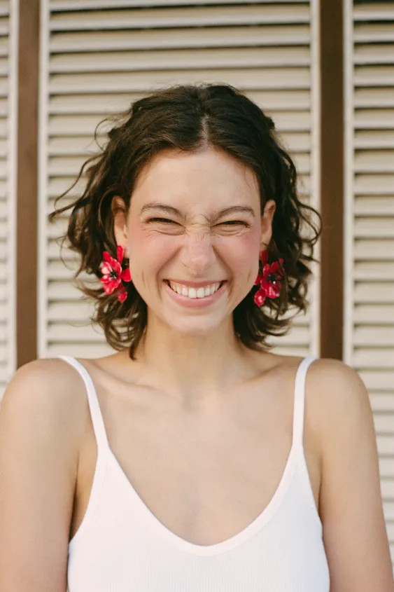 Maxi metal earrings with an embossed flower design. Butterfly clip closure. | Zara US