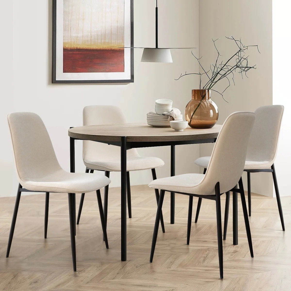 These Brookelyne upholstered dining chairs by Wade Logan are such a clean and modern update for any dining space. The soft neutral fabric paired with sleek black legs gives that minimal, elevated look that works with everything. Styled with a round wood table, pendant light, and simple decor for an effortless everyday setup that still feels polished. 

#LTKSaleAlert #LTKHome