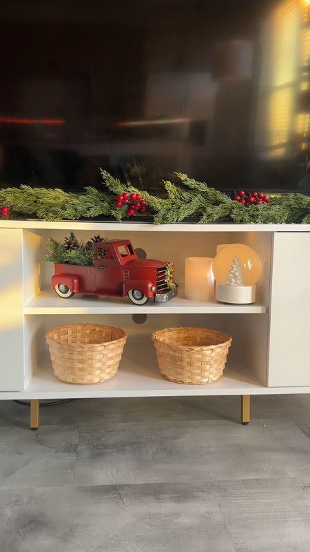 Styling my TV console with Christmas Decor 🎄🤍  garland, snow globe, christmas candles 

#LTKover40 #LTKHoliday #LTKhome