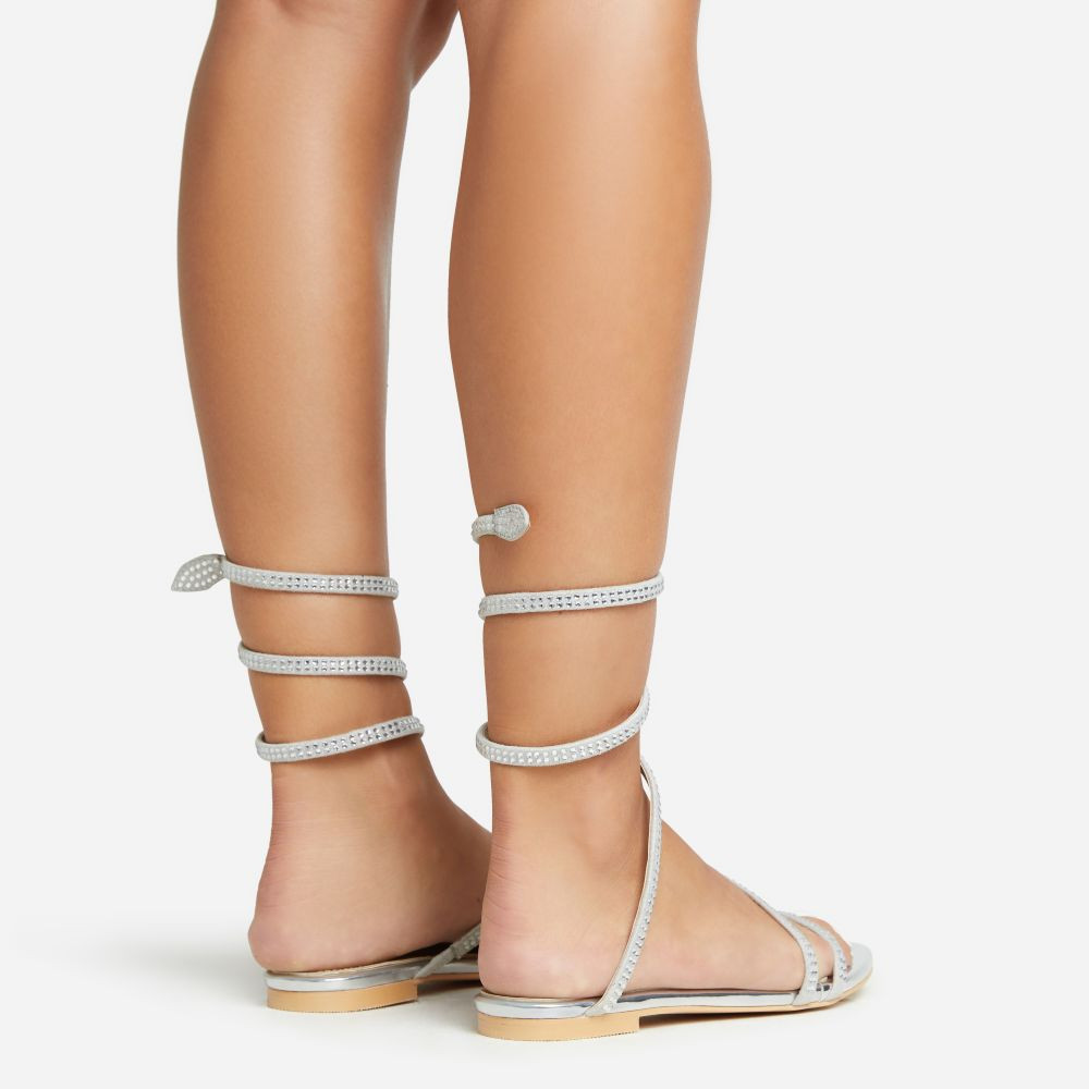 Maribelle Diamante Wrap Around Strap Detail Flat Sandal In Silver Faux Leather | EGO (UK)