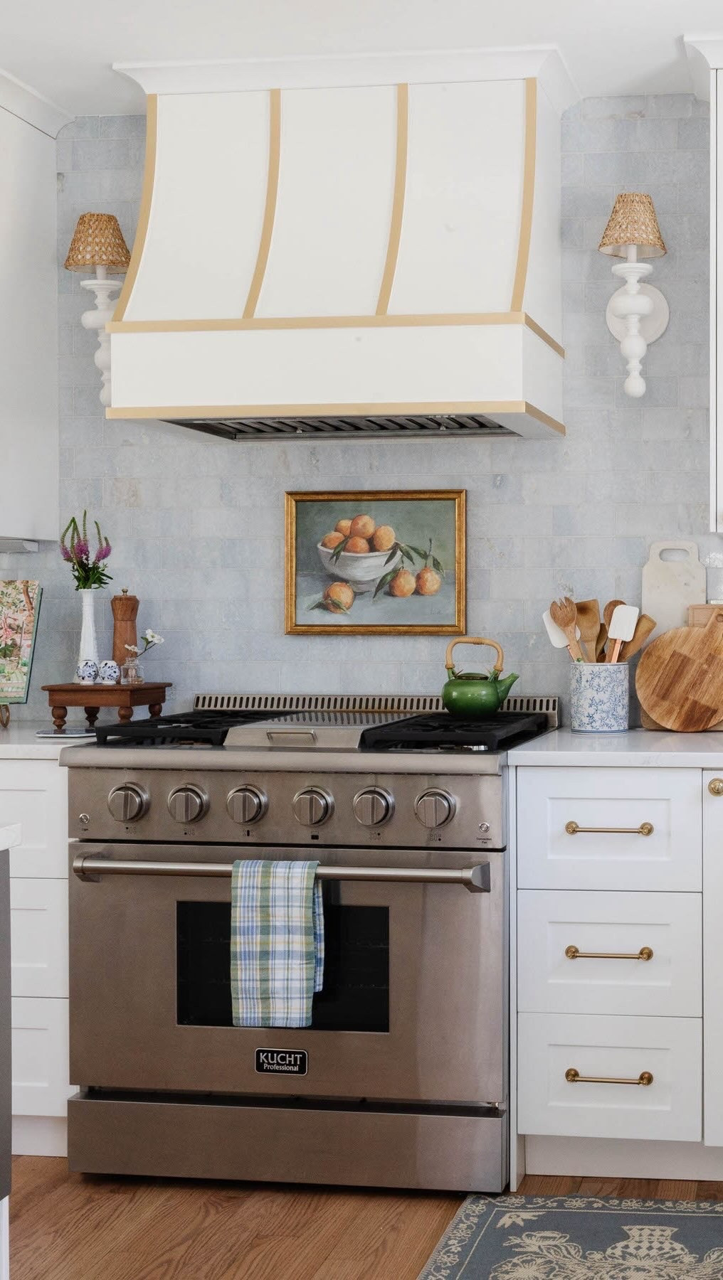 Blue + white forever. 💙🤍
 
This kitchen from #ProjectGrandmillennial in Columbine Valley, Colorado, is proof that a classic kitchen can still have plenty of personality—and that you don’t need a gigantic renovation budget to make a big impact.
 
We kept the foundation timeless with white shaker cabinets from @boxicabinets @semihandmade, then brought in that little bit of something special with blue marble subway tile, a custom hood, and warm brass hardware.
 
The result feels fresh, cheerful, and traditional without feeling too serious—which is basically my favorite combination. 😉
 
It also flows perfectly with the rest of this new traditional home, where blue and white, florals, antiques, and collected details show up again and again.
 
We will never get over this blue marble tile backsplash—it’s the perfect combination of unique and timeless.

Design // @peggyhaddadinteriors 
Photography // @karadeyoung 

To shop the look via LTK comment shop 💙🤍🩵