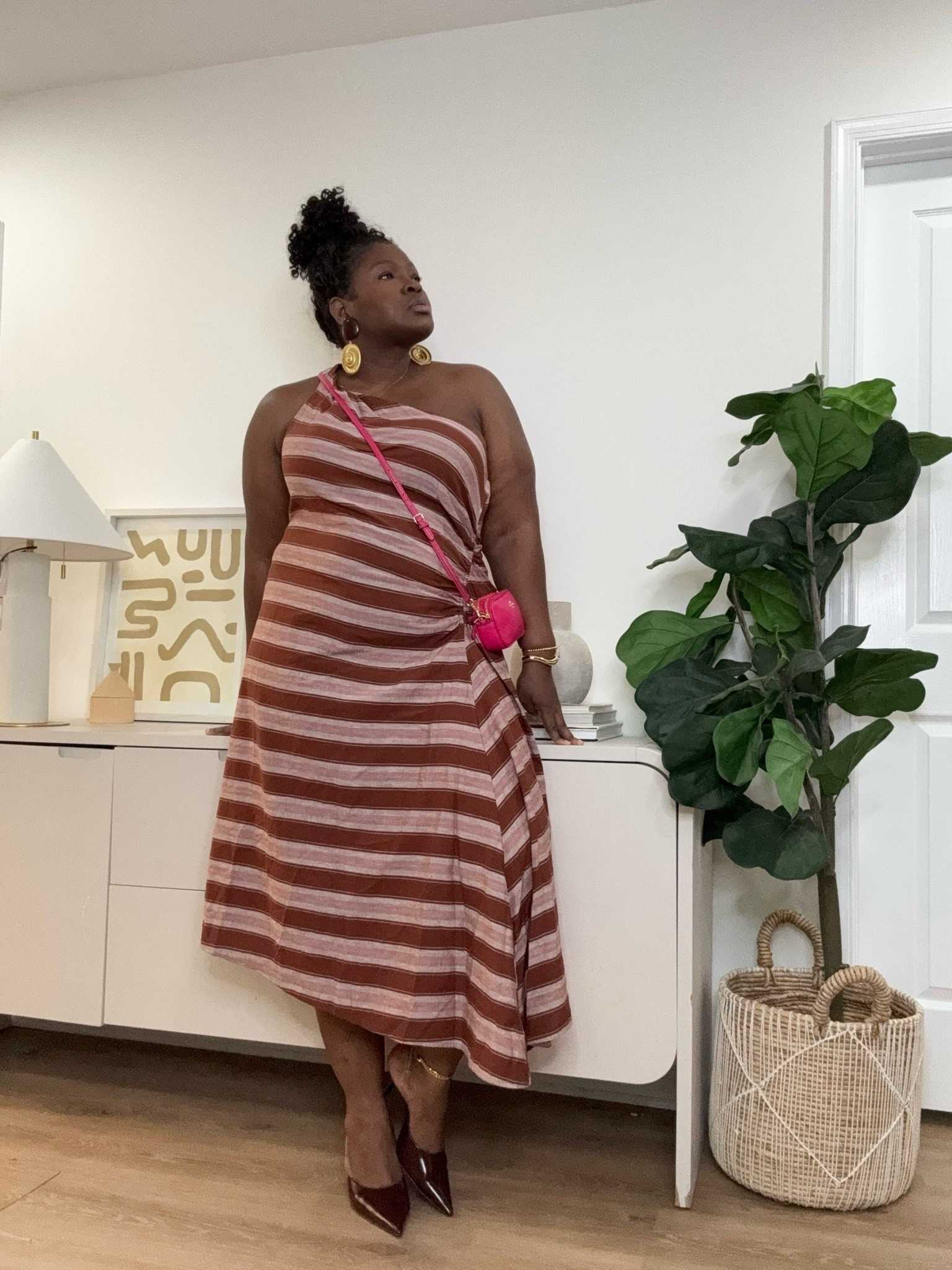 Warm tones, flattering stripes, and a flowy silhouette make this dress the perfect piece for transitioning seasons. It’s feminine, comfortable, and easy to style with your favorite heels, boots, or layered accessories. The kind of outfit that makes you feel ready for any plan.    striped midi dress, one shoulder dress, brown striped dress, curvy fashion, plus size dress, plus size fashion, summer dress, vacation dress, brunch outfit, date night dress, casual chic outfit, women’s fashion, flattering midi dress, fall transition outfit, elegant casual dress

#LTKootd #LTKSeasonal #LTKMidsize