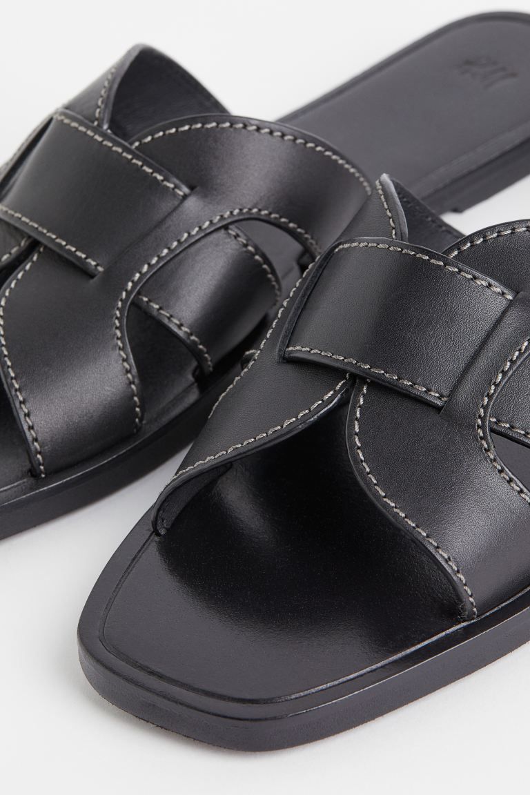 Leather slides with contrasting stitching and wide foot strap. Leather lining, leather insoles, a... | H&M (US + CA)