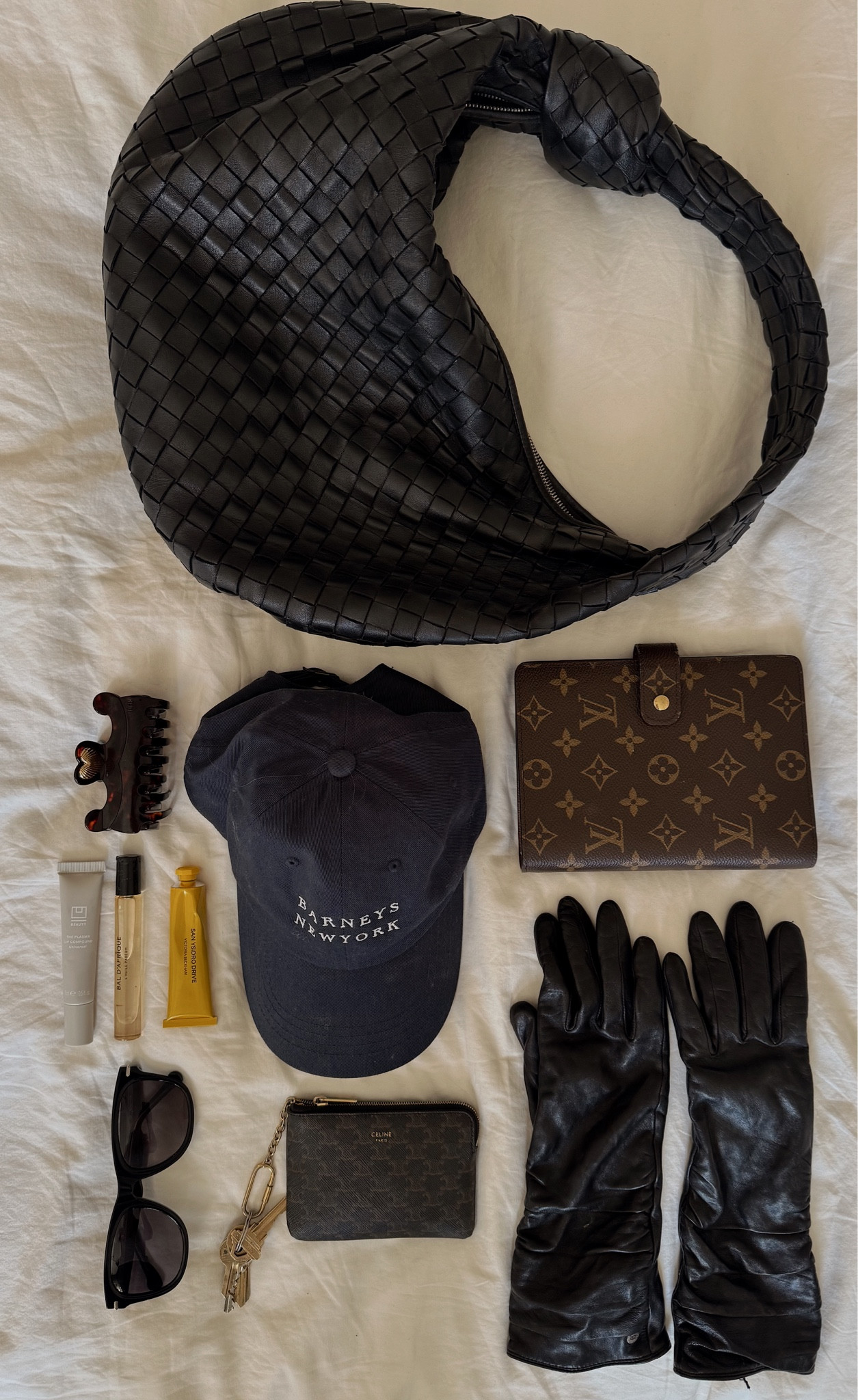 What's in my bag. Gloves are older but included a very similar pair. 

#louisvuittonplanner
#bottegajodie

#LTKItBag #LTKOver40