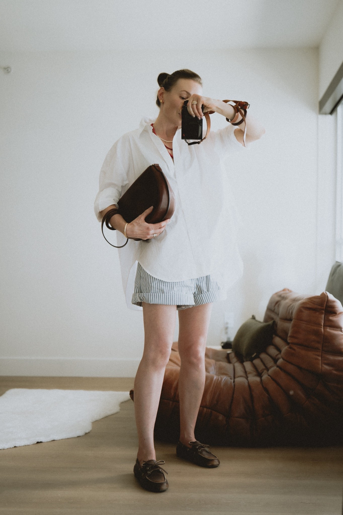 OOtD: oversized shirt + boxer shorts + boat shoes + saddle bag. 

#LTKSeasonal #LTKFindsUnder100 #LTKStyleTip