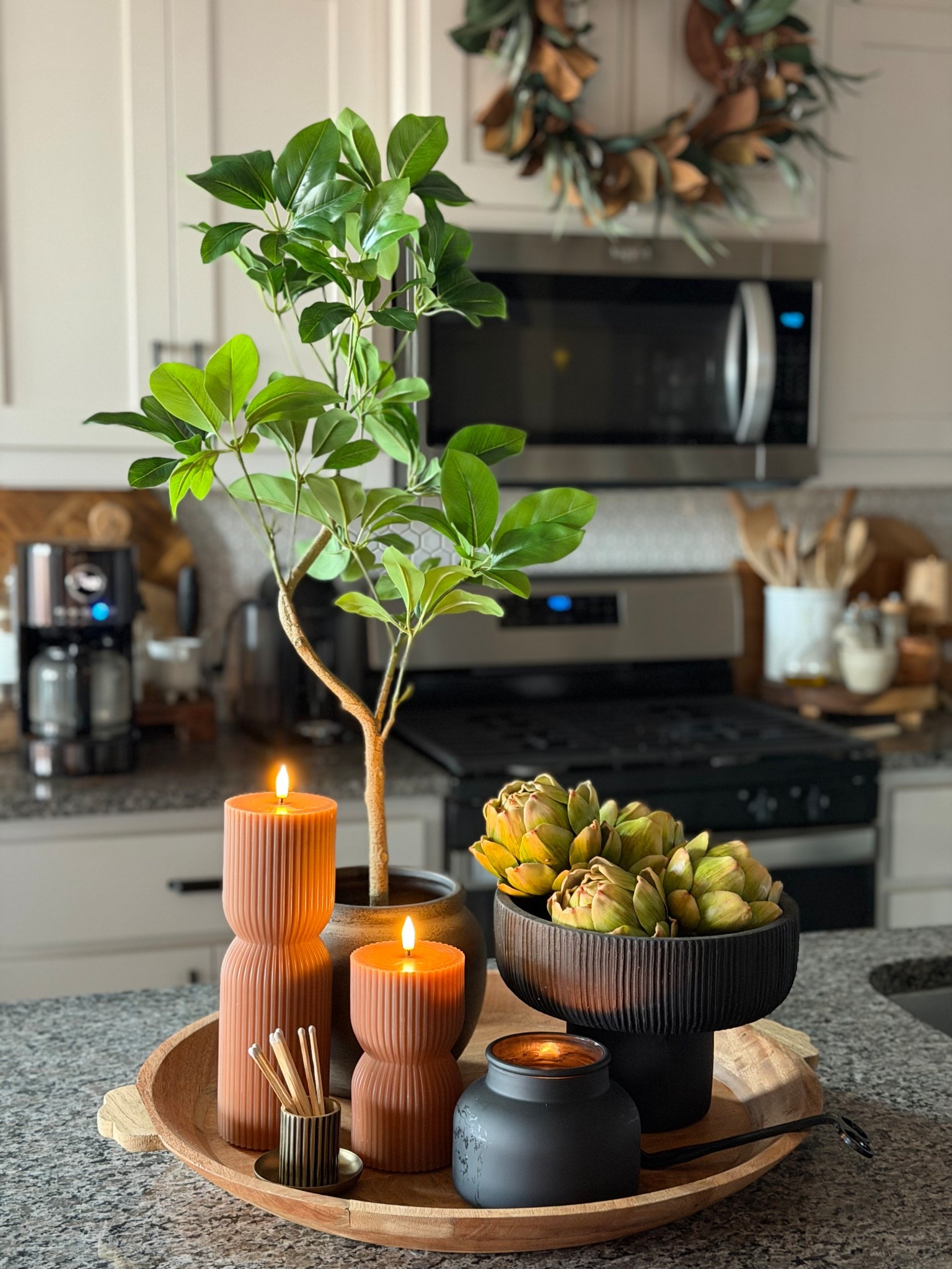 Classic kitchen tray styling , round tray, faux tree, candles, battery candles, faux artichokes 

#LTKHome #LTKFindsUnder50 #LTKSeasonal
