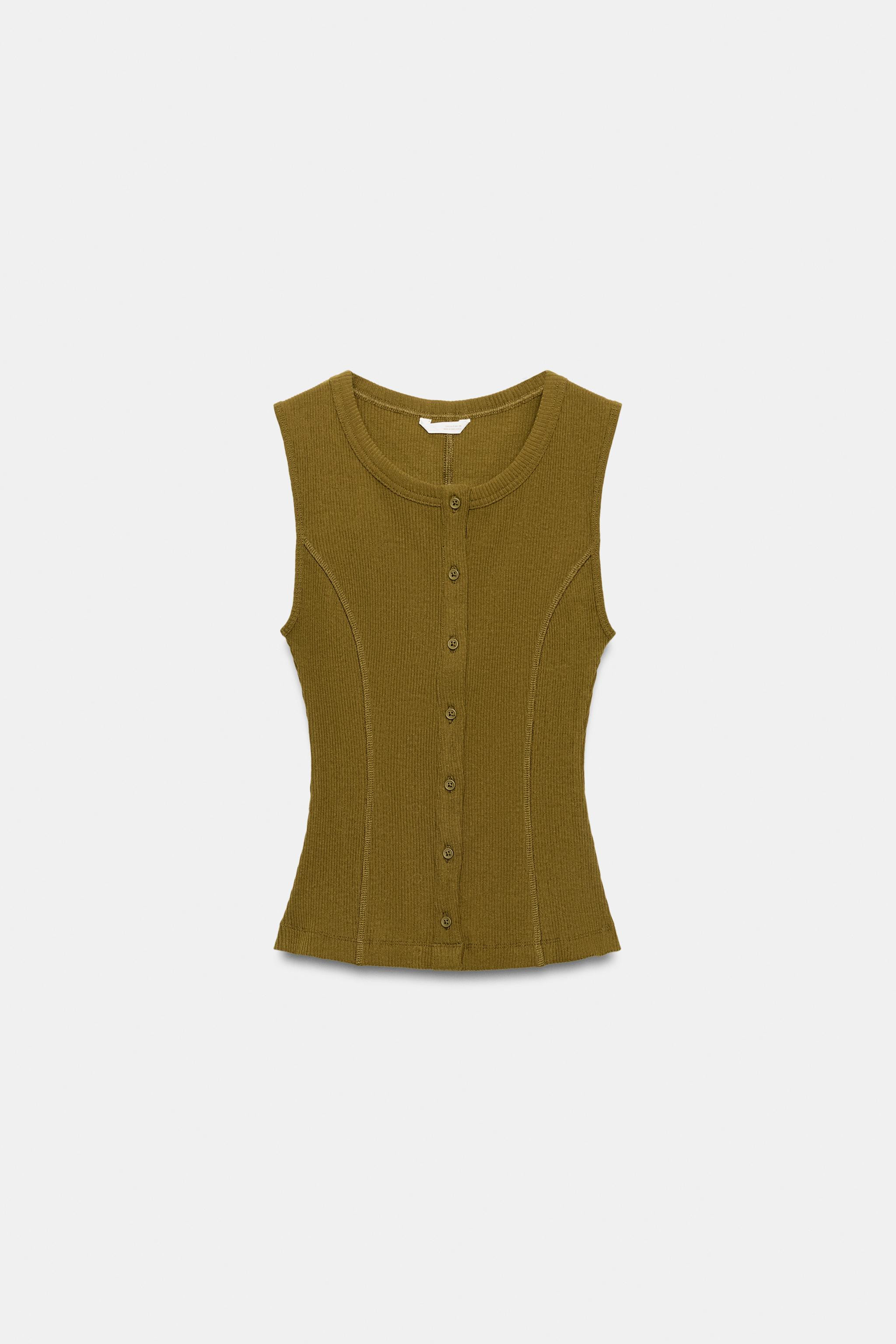 Model height: 174 cmWaistcoat crafted from a cotton blend. Featuring a round neck, sleeveless des... | Zara UK