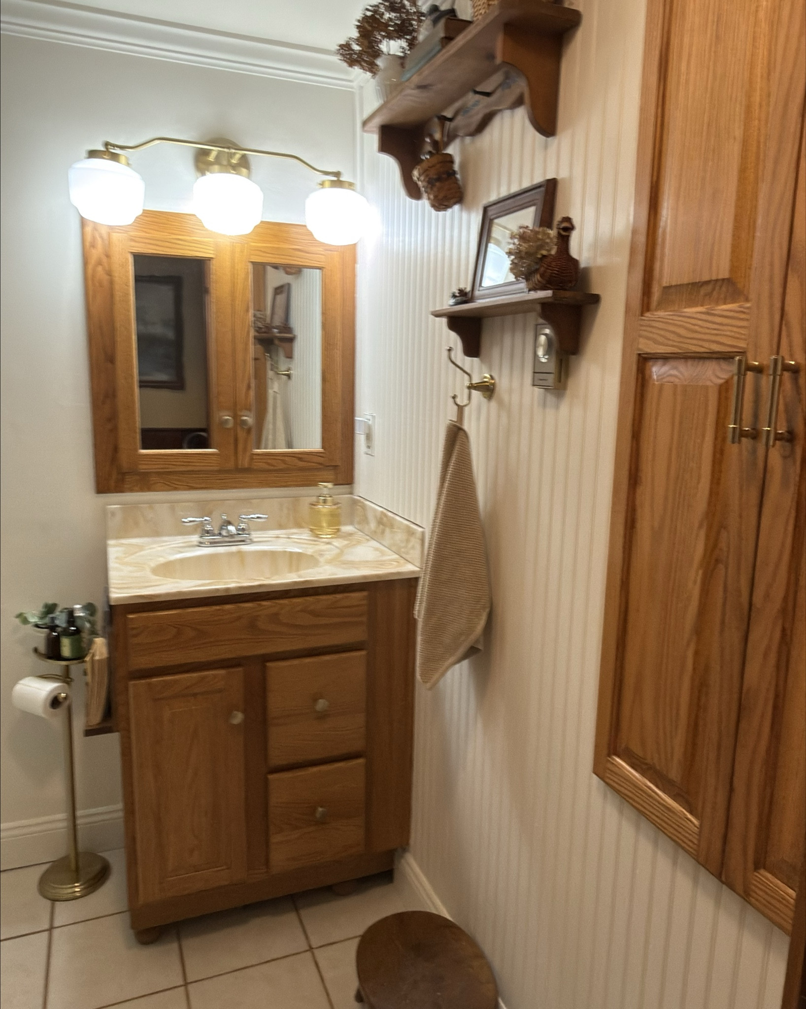 Small bathroom reno, cottage style 🤎🧺🕯️

This tiny bathroom got a cozy refresh with simple, budget-friendly swaps that made the biggest difference — warm brass fixtures, milk glass lighting, soft neutral towels, vintage-inspired hardware, wall art, and functional little details that make the space feel intentional and charming.

Everything linked below is exactly what I used, with a mix of Target + Amazon finds, including a lot of clearance and affordable pieces that work beautifully in small bathrooms. Proof that you don’t need a full remodel (or a big budget) to get that cozy cottage feel.

✨ Perfect for narrow bathrooms, older homes, and anyone craving timeless + warm over trendy.

#LTKHome #LTKFindsUnder100 #LTKSeasonal
