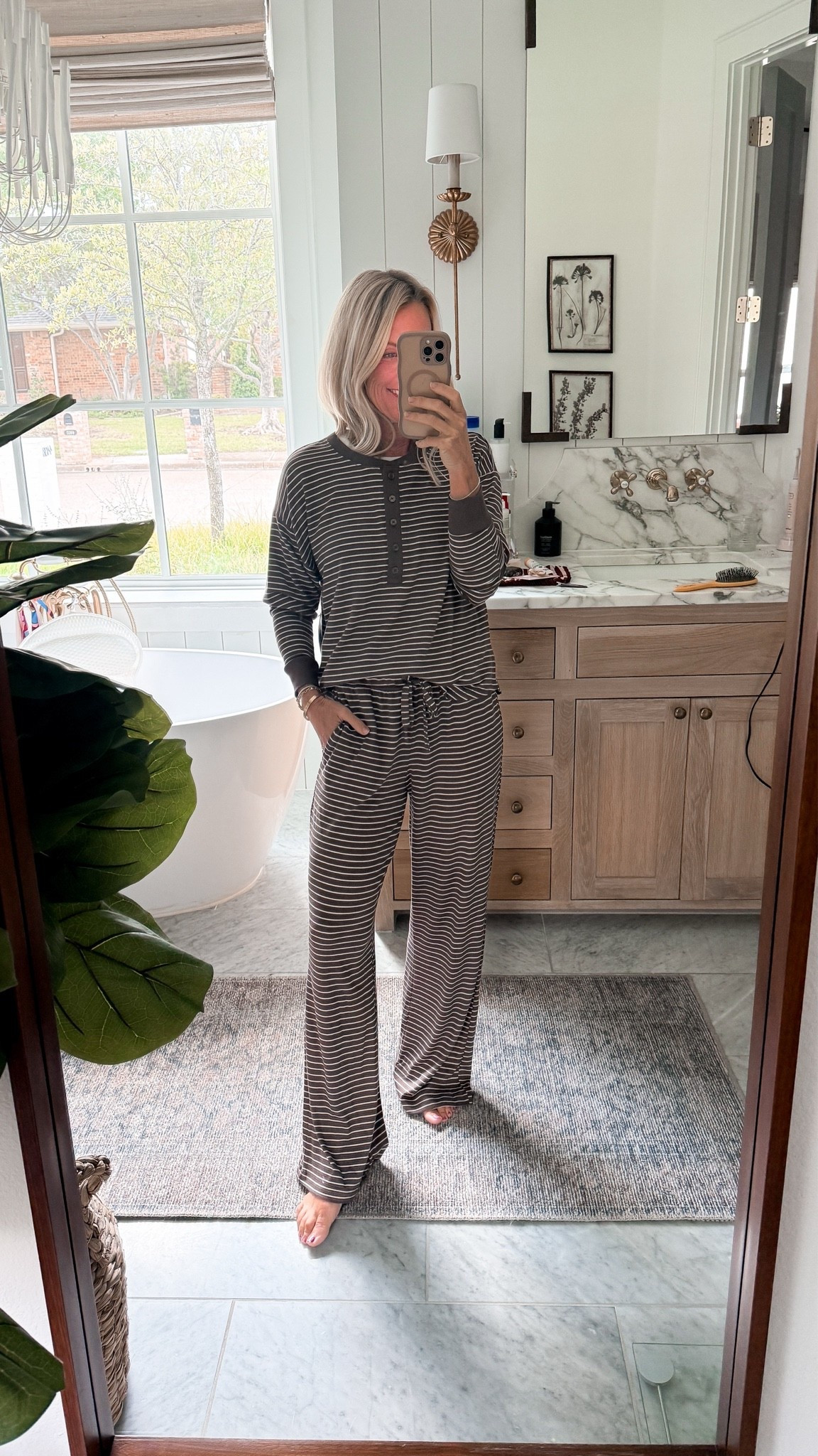 Nothing is screaming fall more than these striped chocolate pjs! Absolutely obsessed with the quality, feel, and price of these pjs finds .

Pj: small