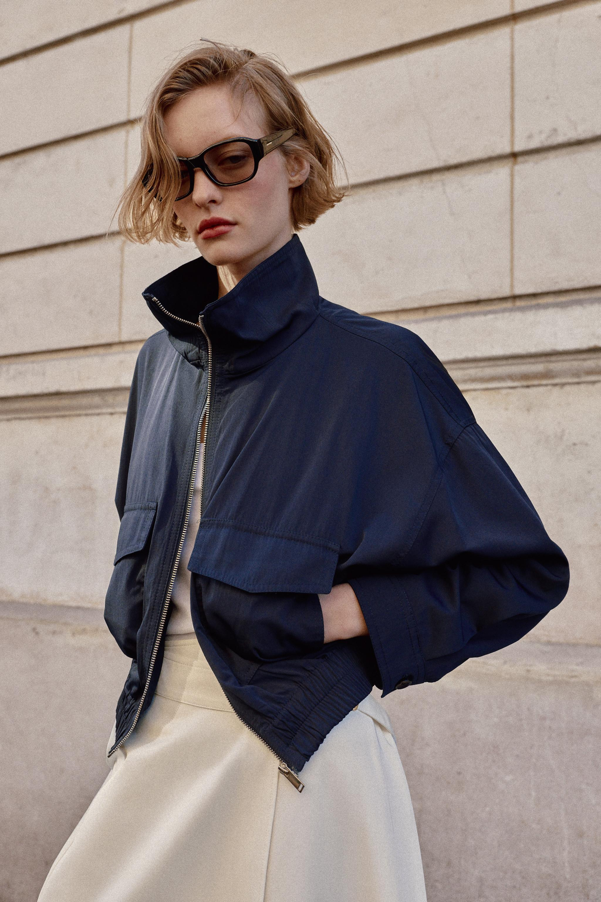 Jacket featuring a high collar and long sleeves. Front patch pockets with flaps, an elastic hem a... | Zara UK