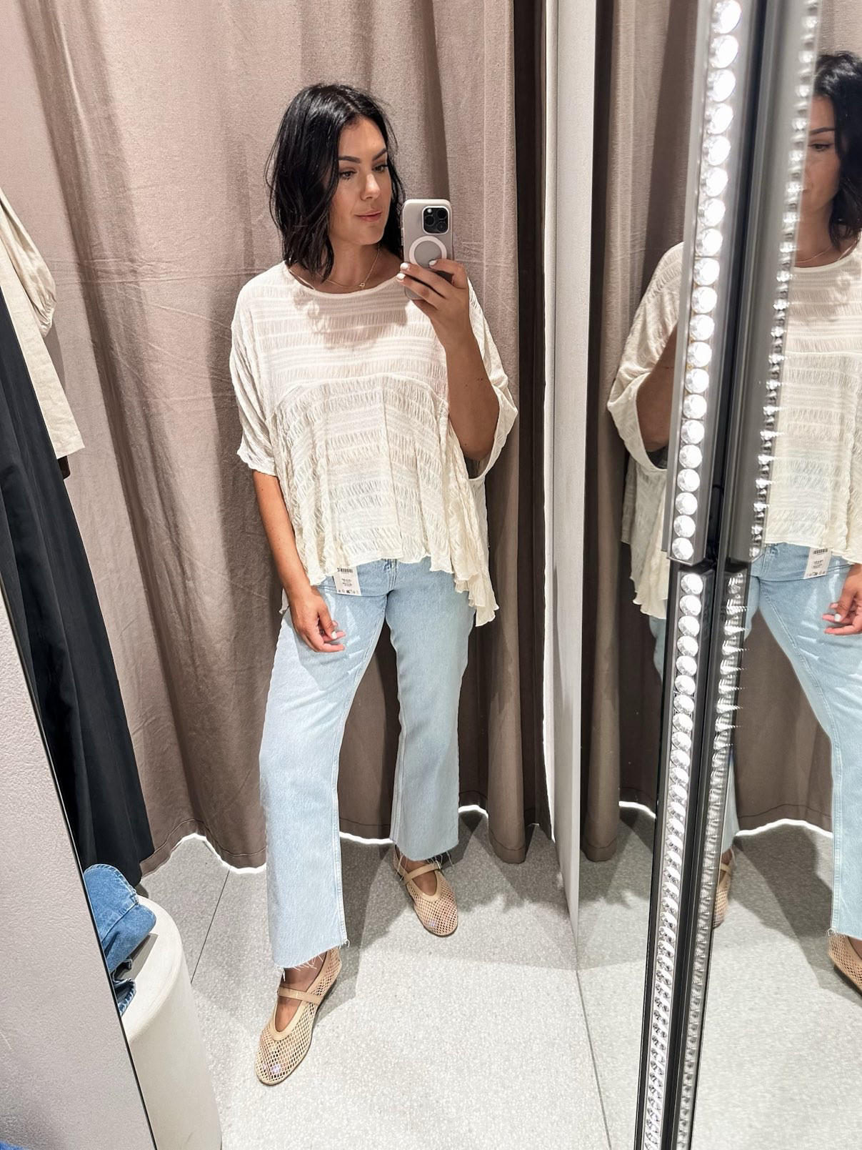 I'm in the large of the top but I think a medium would fit best! It's a looser top to begin with and it has a bouncy fabric overall. It is slightly sheer, so a camisole may be needed. 

The jeans are the best! I'm in the 8 -- true to size but they run most fitted at the waist / hips.  

 