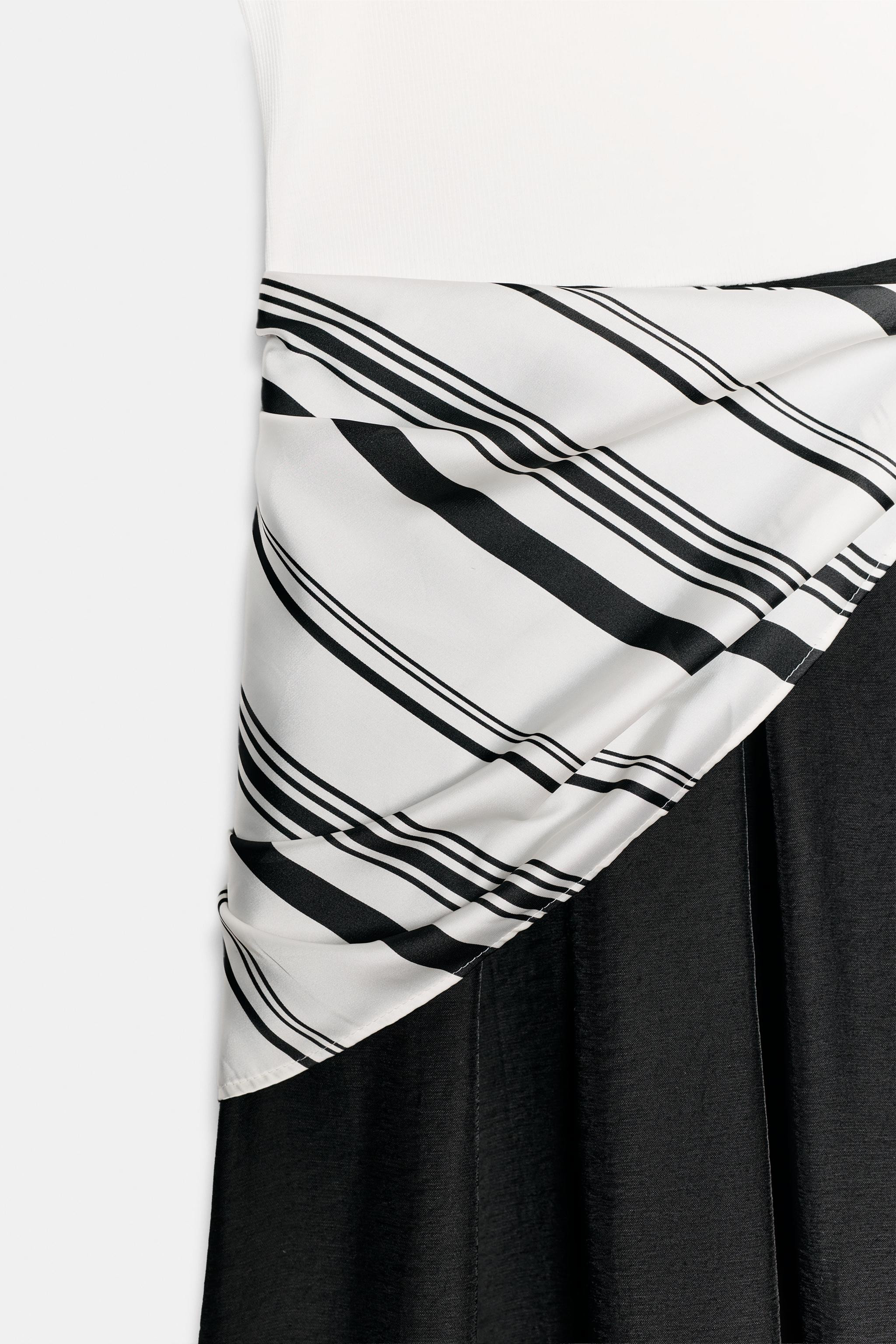 Round neck sleeveless dress. Features contrasting fabric detail and a knotted scarf at the waist.... | Zara US
