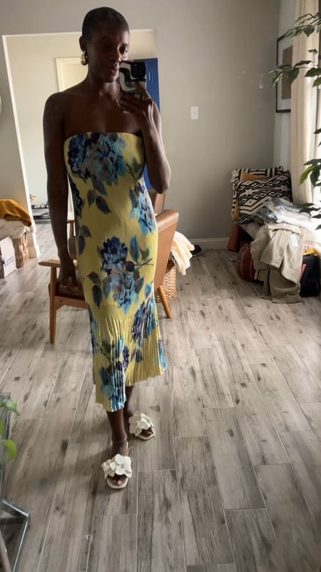 Wedding guest dress! Yellow pleated dress with blue floral print, white floral slides and gold drop earrings. Beautiful vacation dress too!

#LTKstyletip #LTKtravel #LTKwedding
