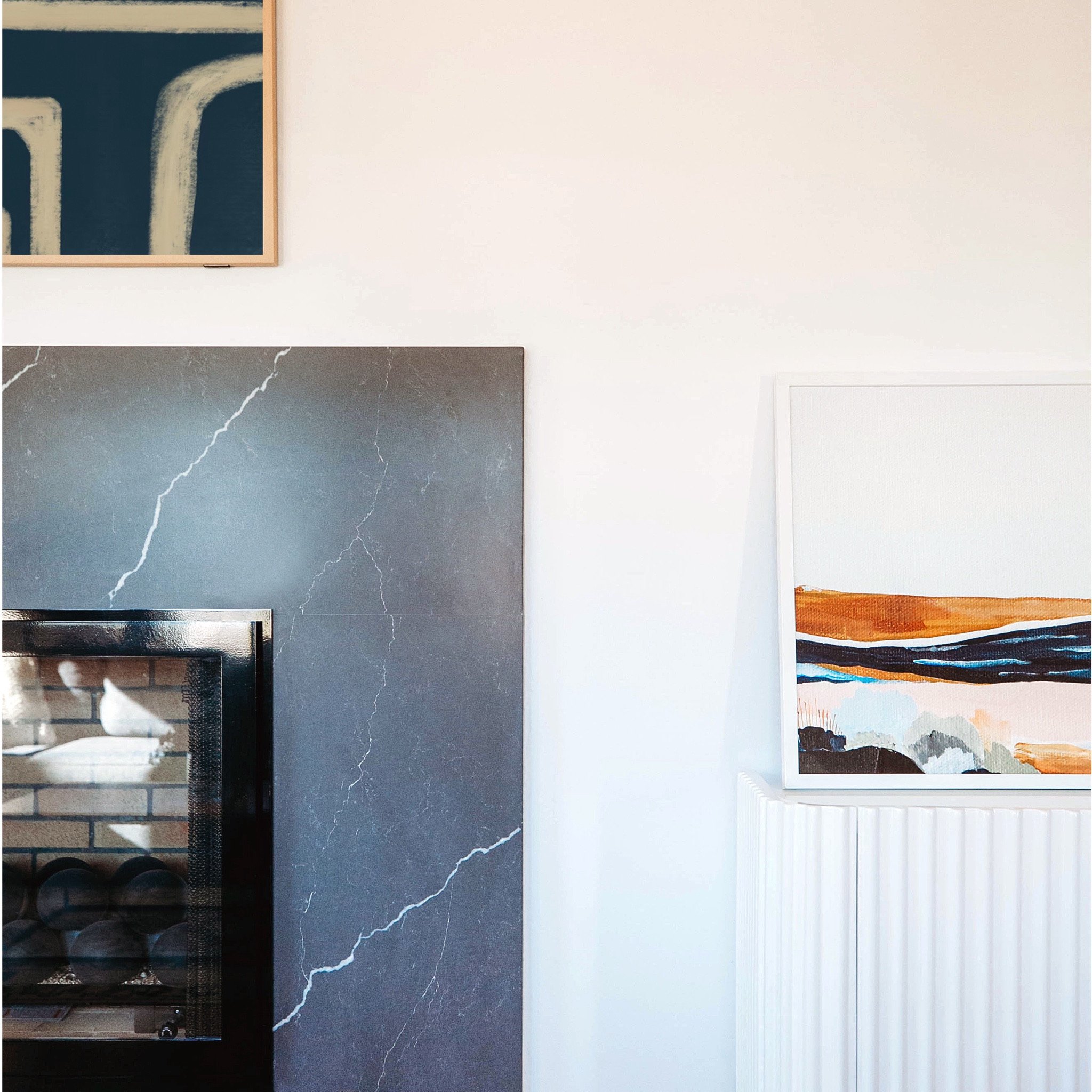 sometimes less is more. #dwelloctoberstudio gave this fireplace a makeunder by removing the stone veneer and traditional wood mantel and replacing it with a modern, minimalist dark stone surround. the wood burning fireplace was converted to gas and features ceramic fire spheres. #dwelloctoberrealestate #dwelloctober

#LTKhome