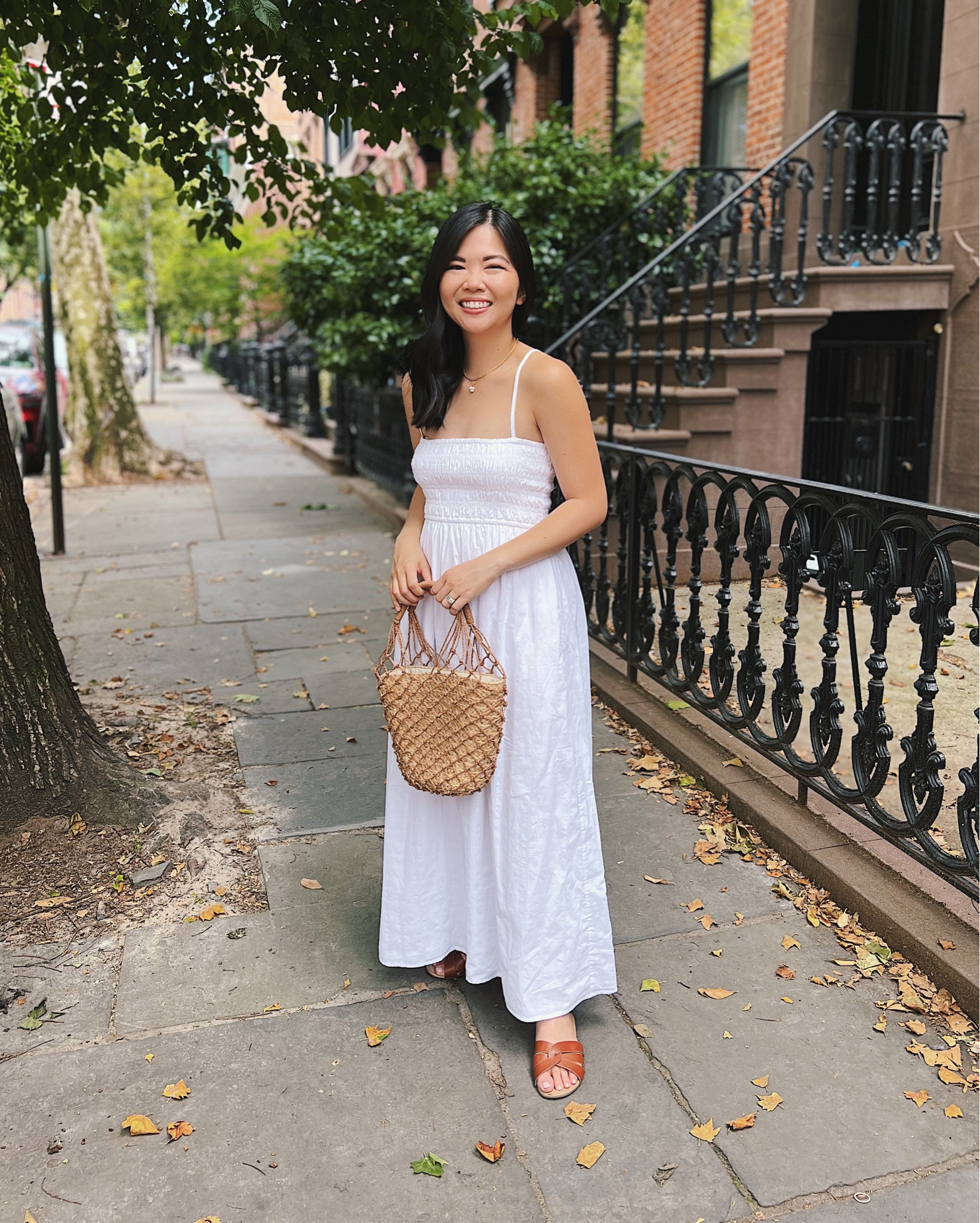 White maxi dress (XS) - adjustable straps, pockets, smocked top, subtle striped texture.
White dress
Madewell dress
Straw bucket bag
Net bag
J.Crew Sedona bag
Brown slide sandals
Gold chain necklace
Gold flower necklace
Delicate necklace
Summer dress
Summer outfit
Vacation dress

#LTKunder100 #LTKFind #LTKstyletip