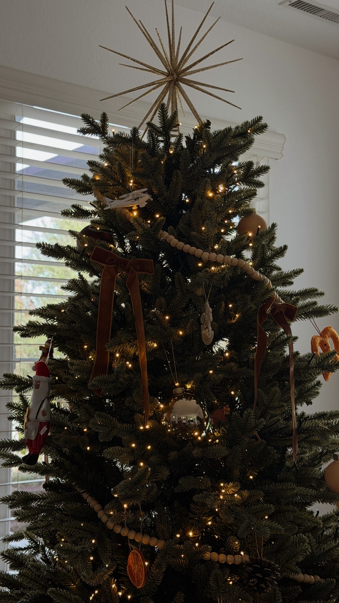 Faux Christmas’s tree and bow ornaments 

#LTKHoliday #LTKFindsUnder100 #LTKHome